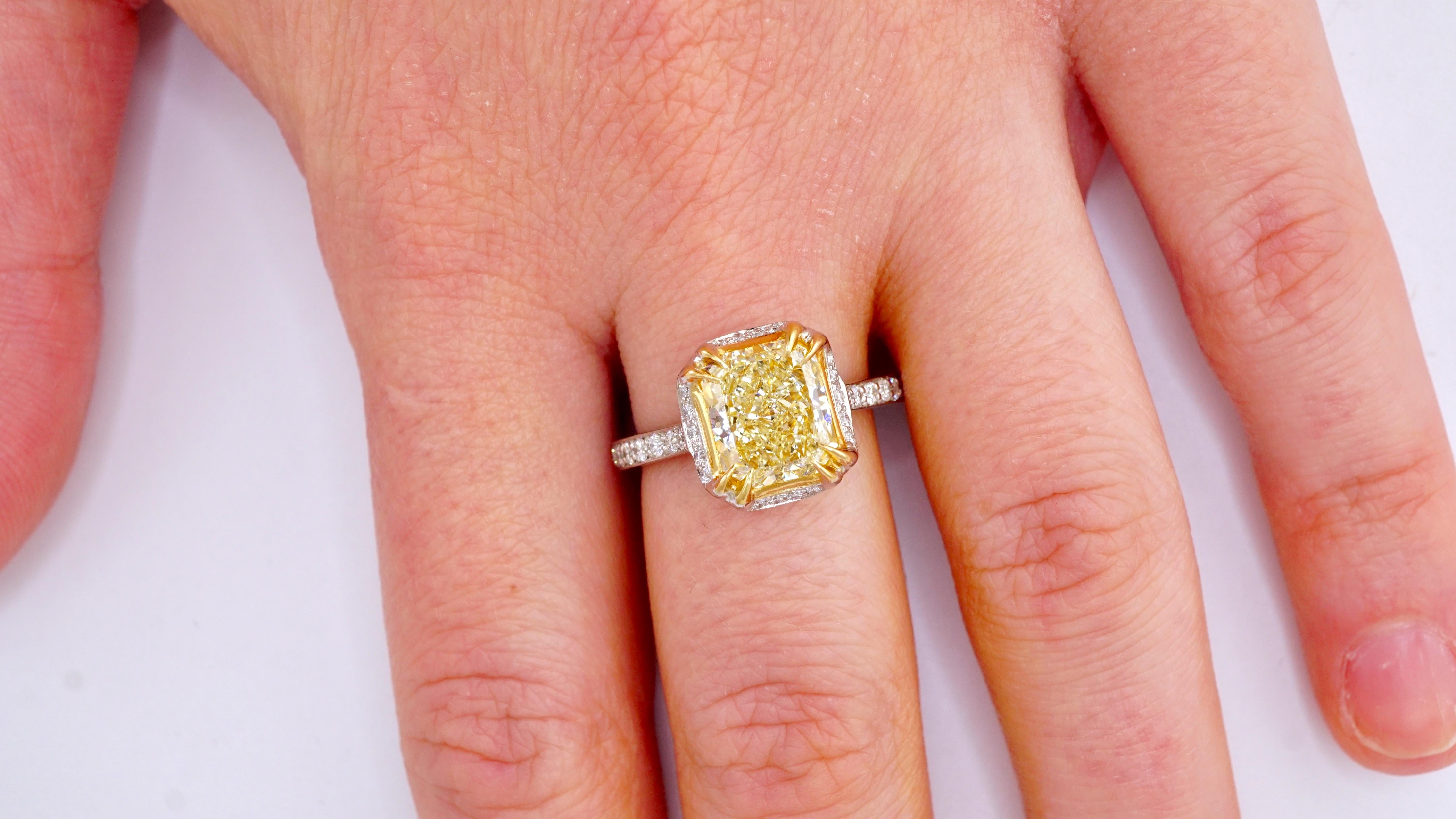 GIA Certified 2.33 Carat Fancy Yellow Radiant Diamond Ring in Platinum In New Condition In New York, NY