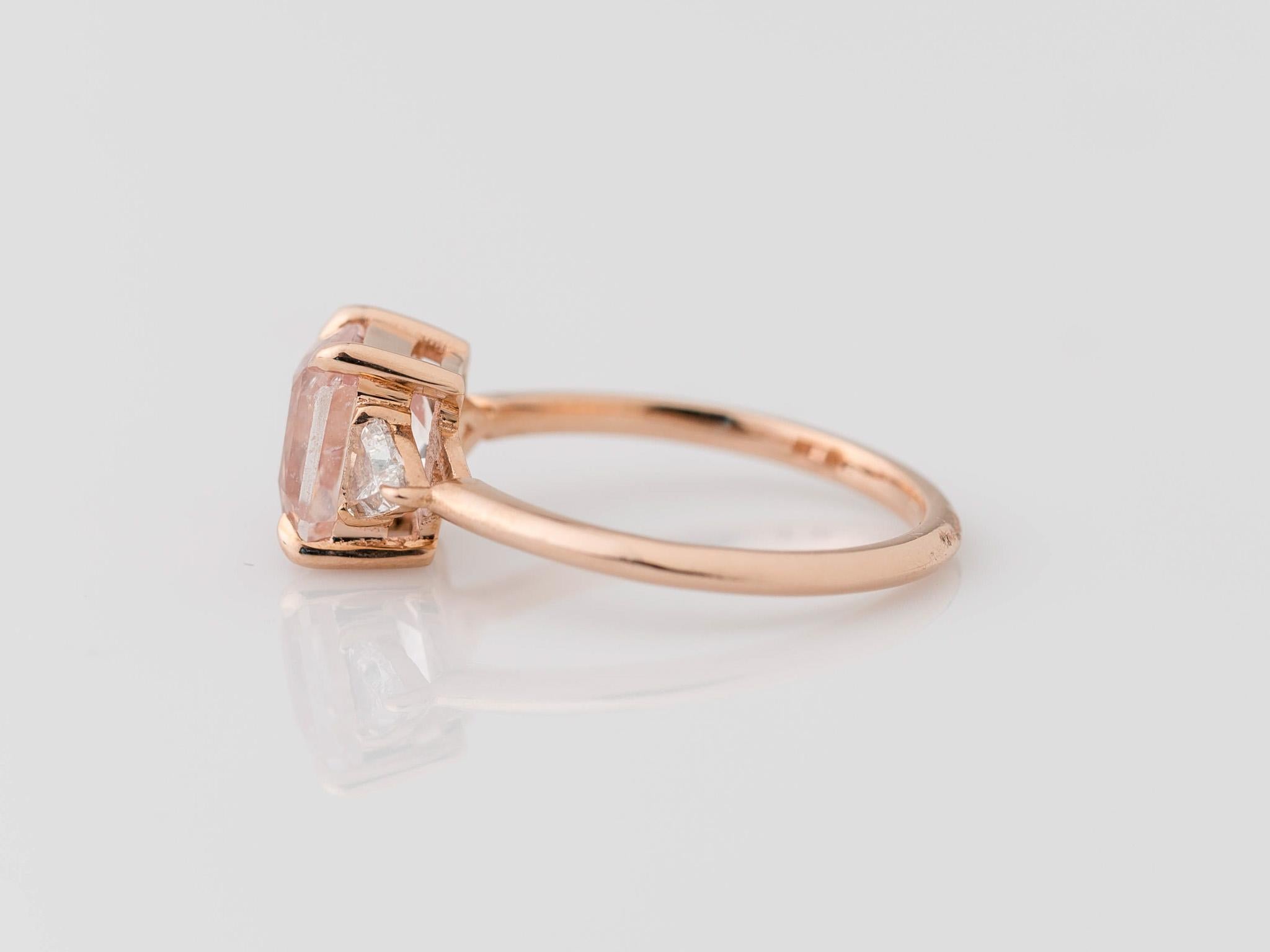 Embrace the allure of rarity with our exquisite 14K Rose Gold 3-Stone GIA Certified Padparadscha Sapphire Ring. The centerpiece, an ultra-rare unheated and completely natural radiant-cut Padparadscha sapphire, weighing 2.34 carats and measuring