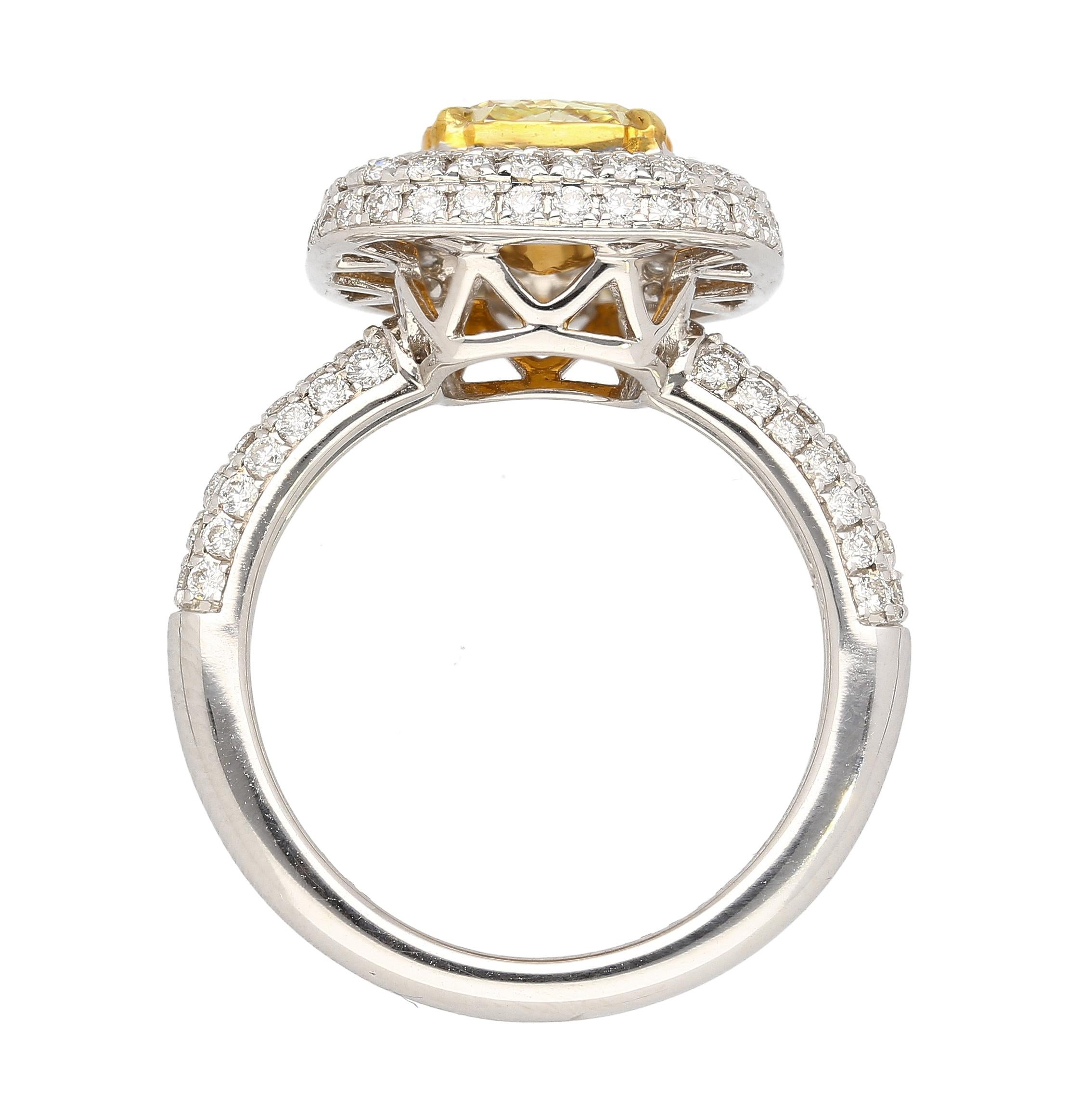 Women's GIA Certified 2.35 Radiant Cut Fancy Yellow Diamond Ring in 18k White Gold For Sale