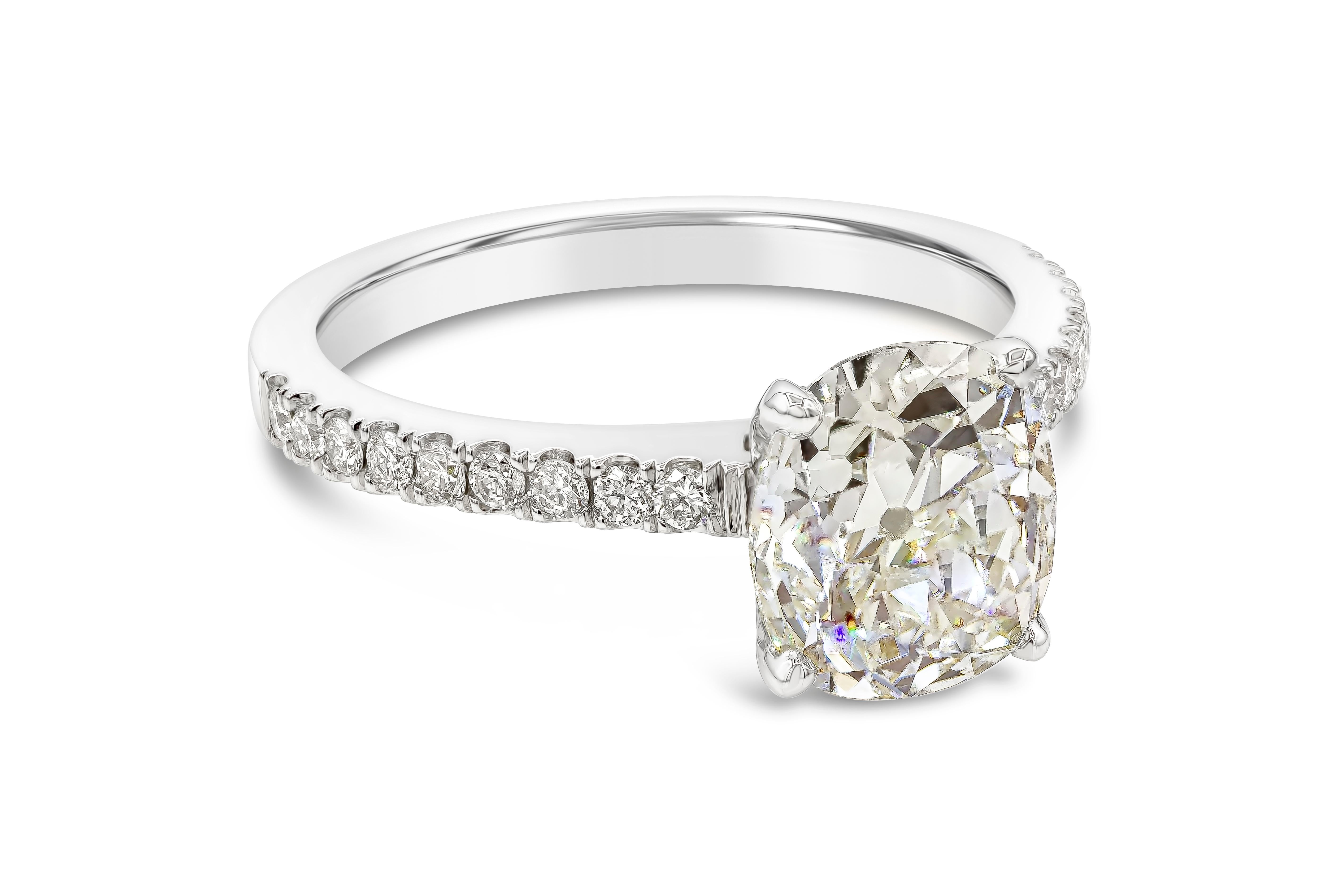 Featuring a 2.36 carat cushion cut diamond center stone set in a simple and timeless pave setting made in platinum. Accent diamonds weigh 0.24 carats total. Center diamond is accompanied by a GIA report stating it is certified as L color, VS1