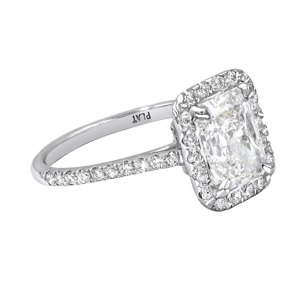 GIA Certified 2.36 Carat Radiant Cut Engagement or Anniversary Ring In 14k YG. Original Radiant Cut Diamond VS2 clarity I color GIA certified 
Halo and Sides contain  .80ct round brilliant diamonds.
The diamonds are handset in prong setting.
The