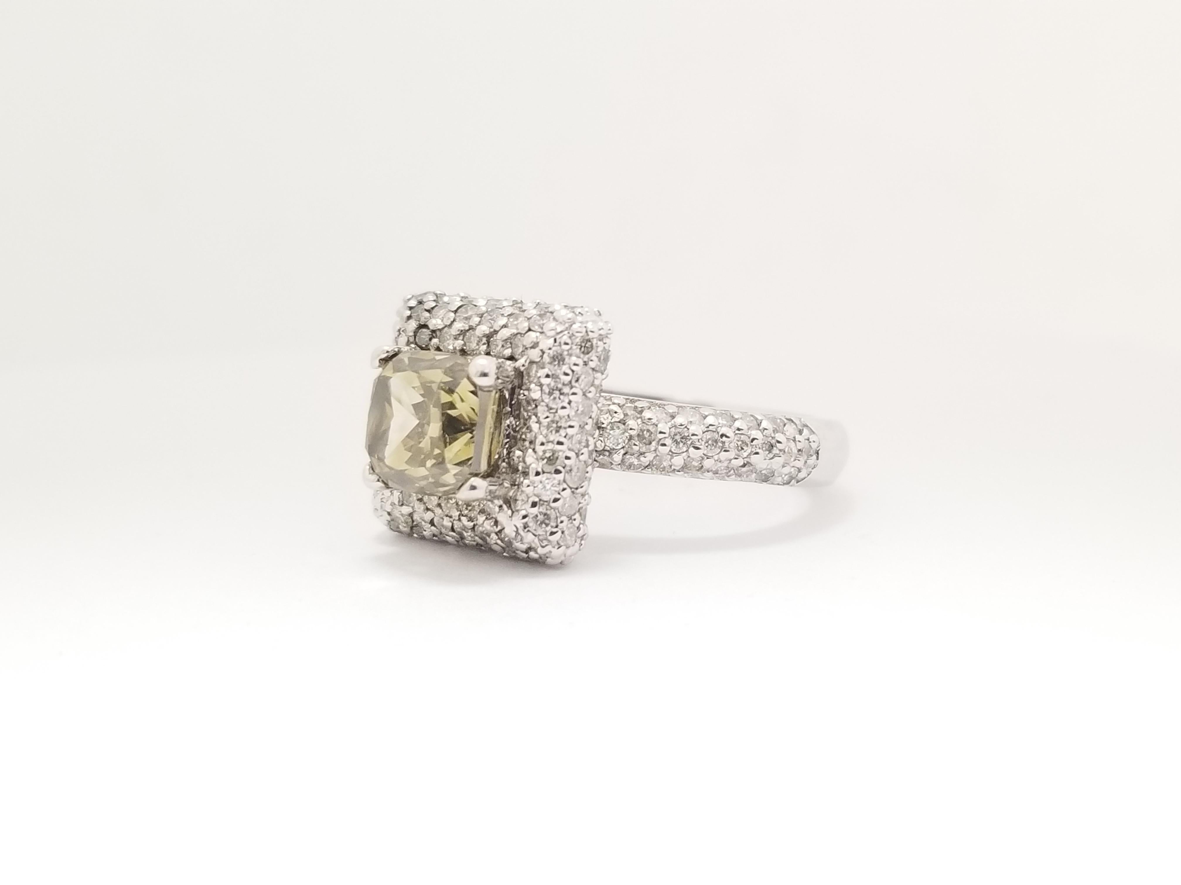 GIA natural cushion cut diamond weighs 2.37 Carats. 4 prong center set surrounded by 1.50 cttw paved round white diamonds 14K white gold setting. 
Color: Natural Fancy Dark Brown-Greenish Yellow , Vs2 clean 
Ring size 7 can be resize.