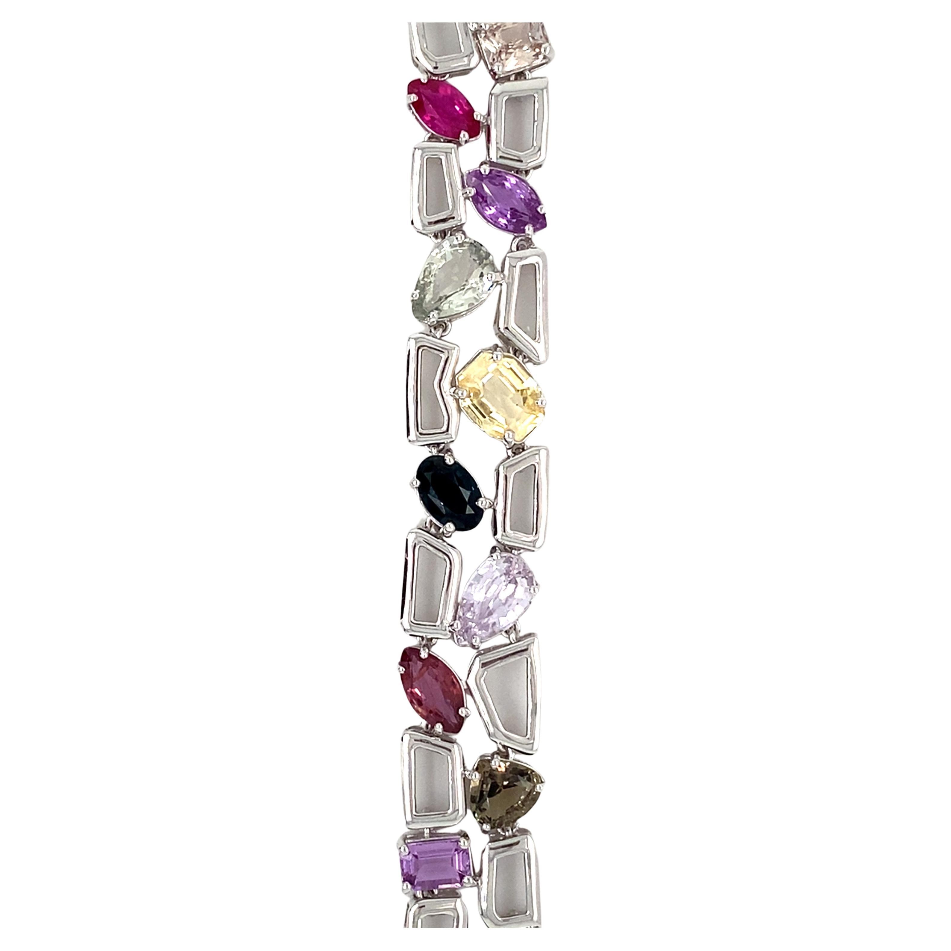 This exquisite 23.72-carat multicolor sapphire bracelet is crafted with no-heat sapphires and set in luxurious platinum. Featuring a contemporary design, it is accompanied by both a GIA certificate and an appraisal report for added assurance of its