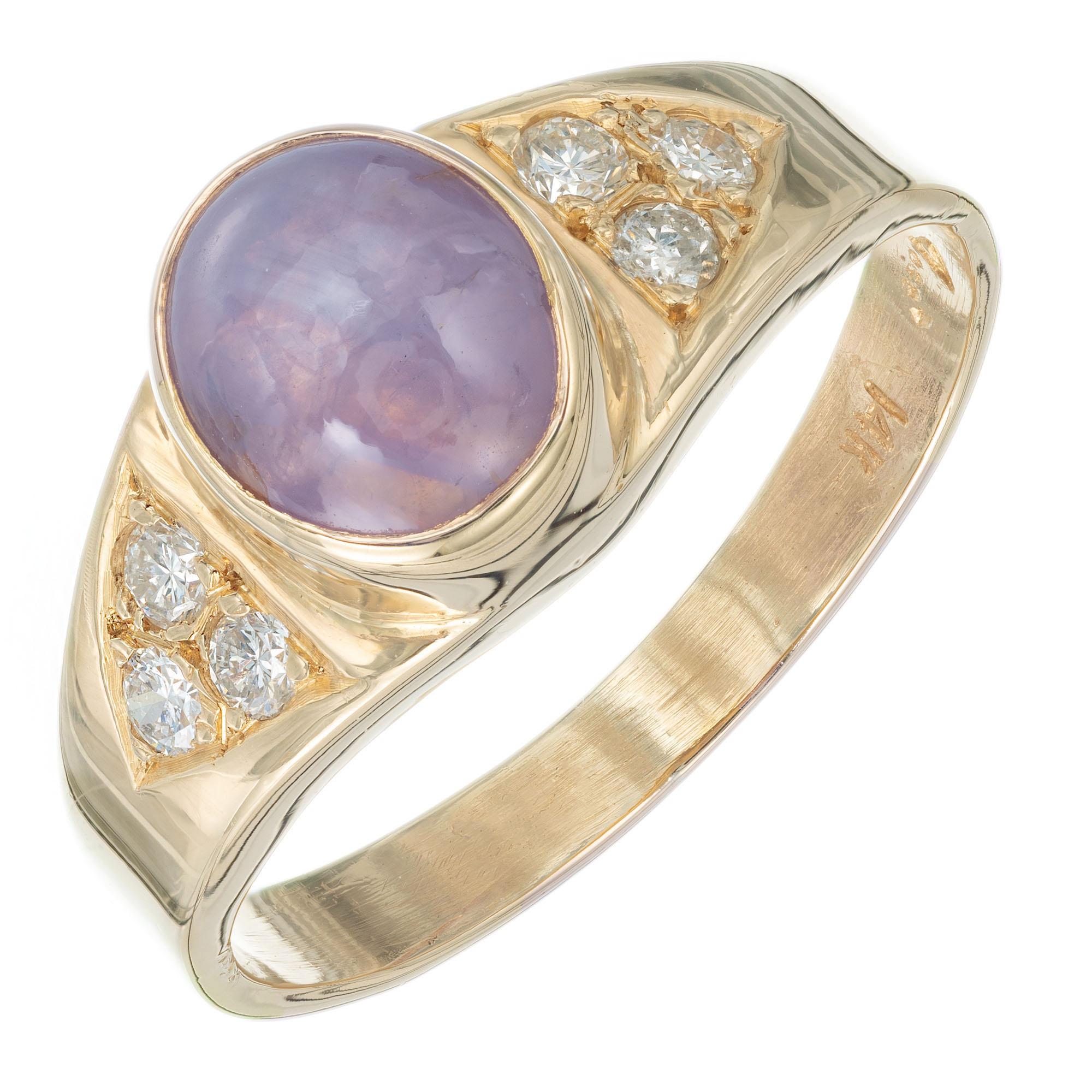 GIA certified natural untreated 2.38 carat star sapphire. Light violet color oval bezel set cabochon center stone in 14k yellow gold setting with 6 diamond accents. 

1 oval cabochon light violet star sapphire MJ, approx. 2.38cts GIA certificate #