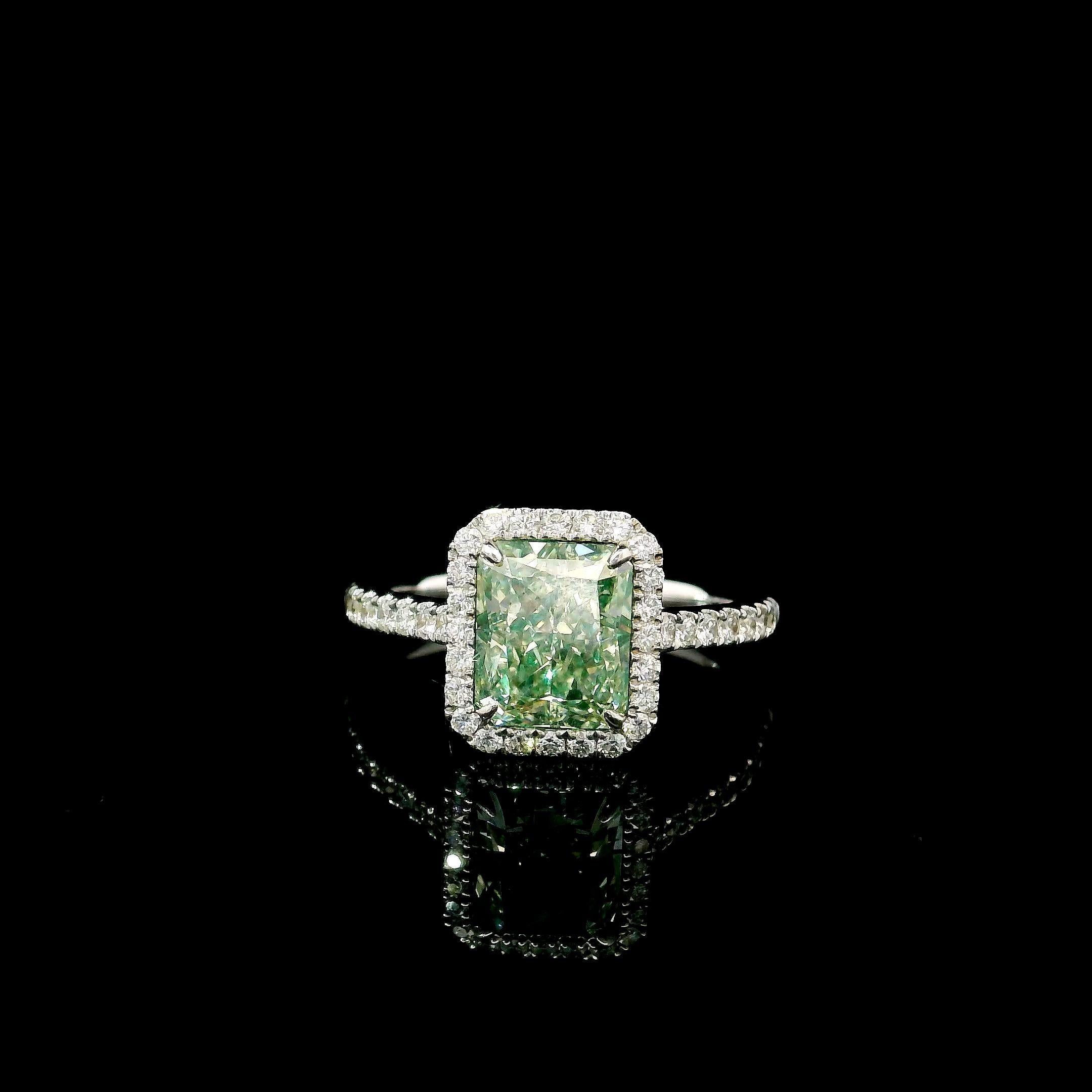 18kt white gold ring with diamonds
  
  Gold colour & karat: White gold 18kt
  Weight: 3.55 grams
  
  Set with-
  Stone type: Diamonds
  Shape: Radiant
  Carat: 2.38
  Colour: Fancy Light Greenish Yellow
  Clarity: VS1
  
  Surrounding Stones: