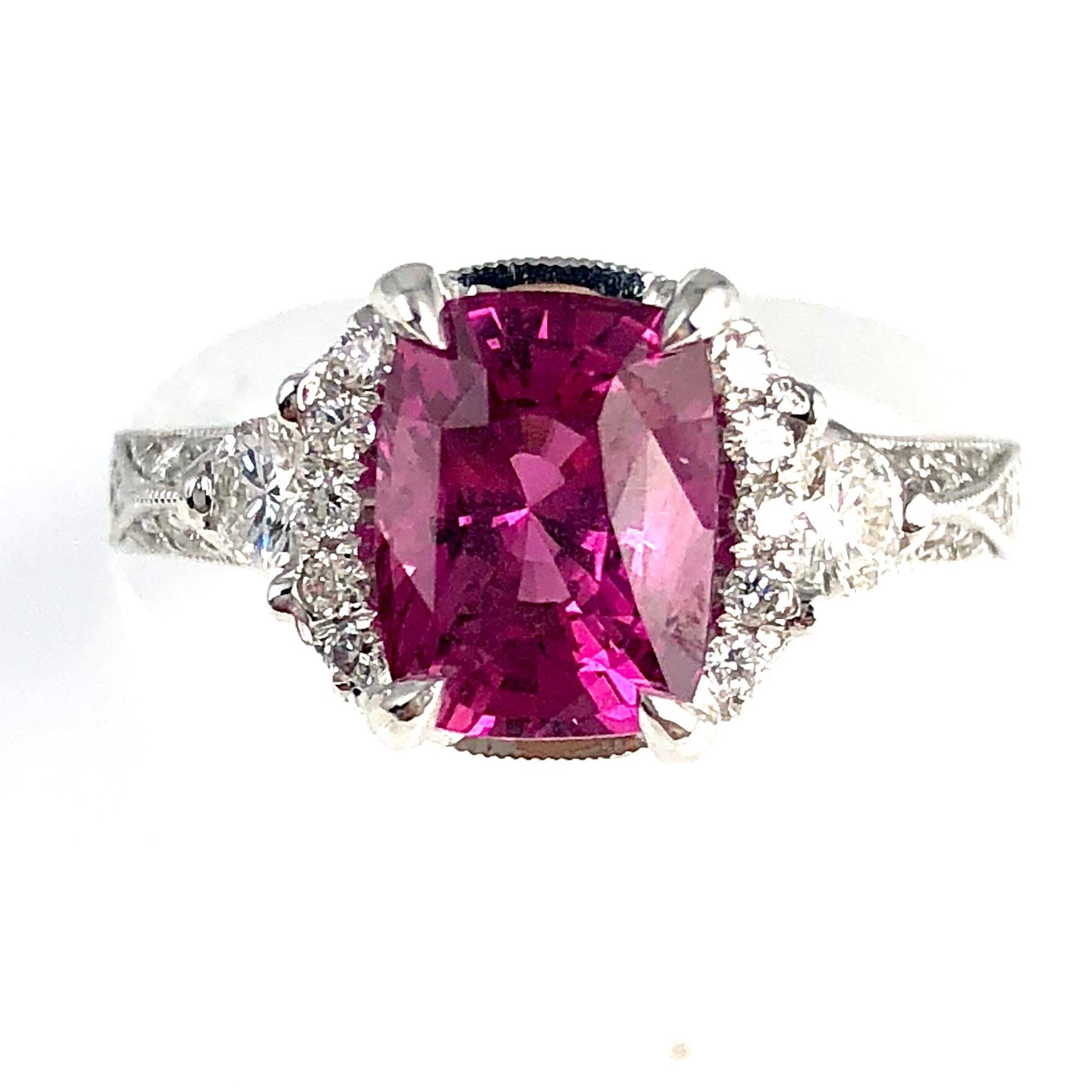 (DiamondTown) With a GIA Certified 2.39 carat cushion cut exotic pink sapphire center, and 0.61 carats white diamonds, this ring shines from every angle.

GIA Certification details (see photo):
The center sapphire is Transparent, Purplish-Pink, 8.51