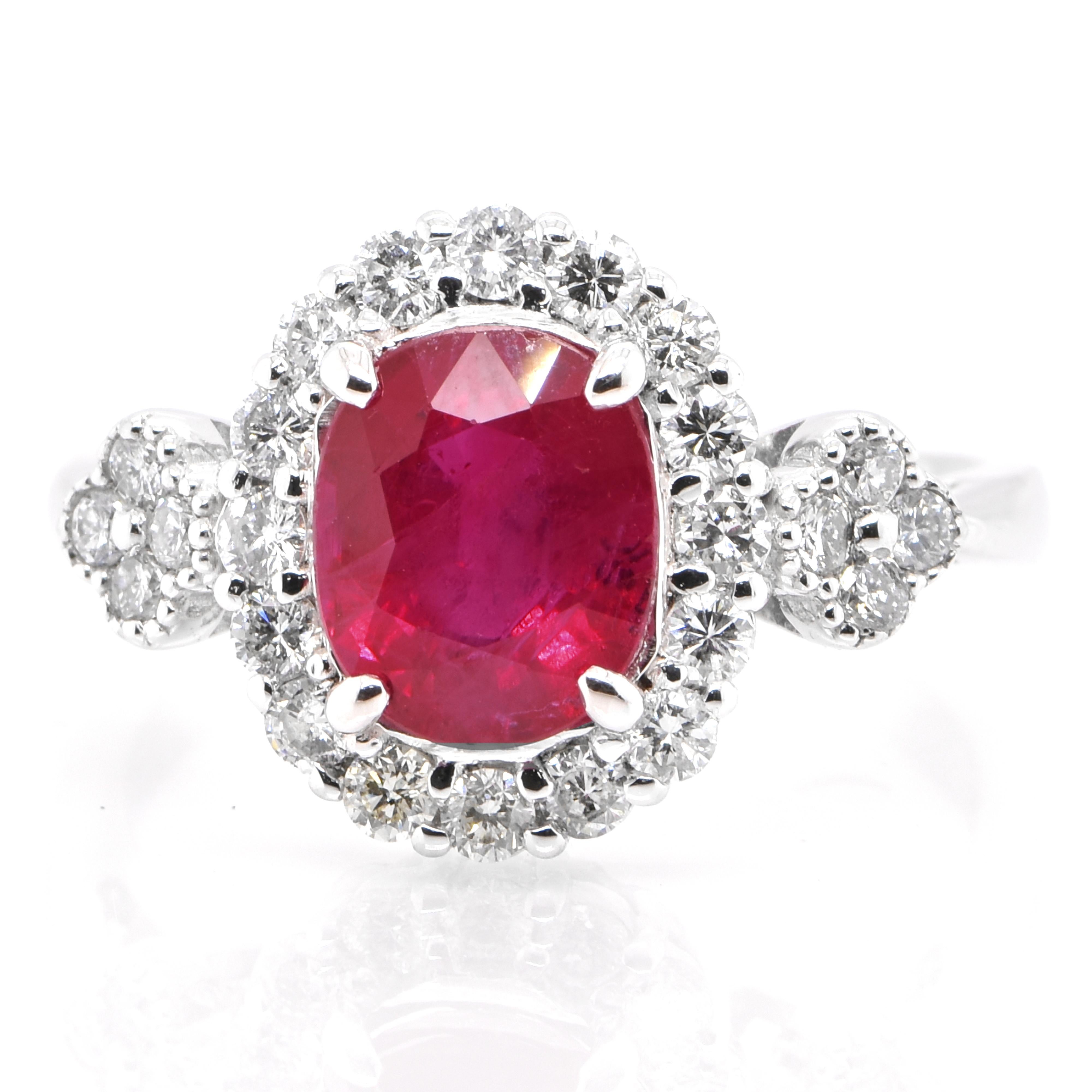 A beautiful ring set in Platinum featuring a GIA Certified 2.39 Carat Natural Ruby and 0.55 Carat Diamonds. Rubies are referred to as 