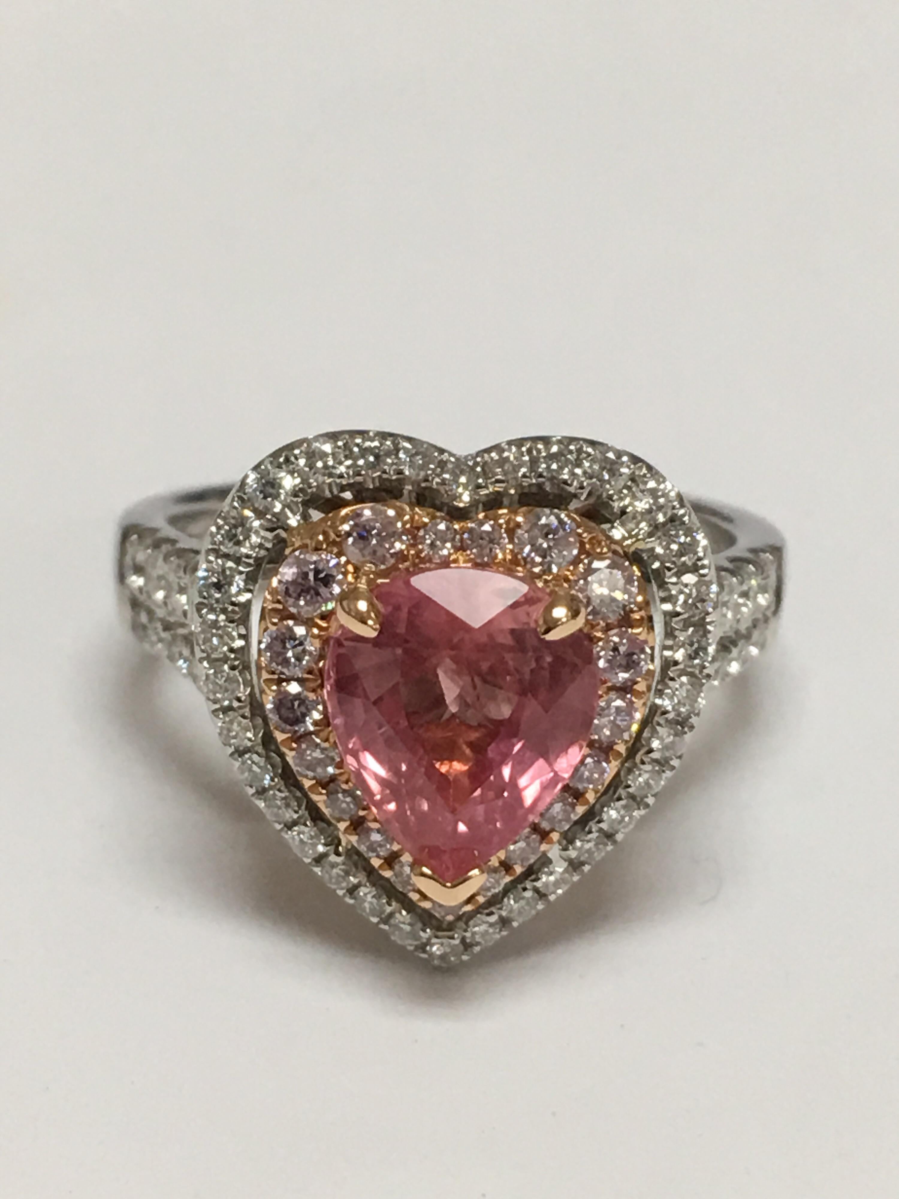 GIA Certified 2.39 Carat Pear shaped Padparadscha Sapphire Diamond Engagement Ring set in 18 Karat two tone gold. Double Halo heart shaped with White Diamond 0.49 carat and Pink Diamond 0.30 carat. Ring size is 7 and can be resized if needed.