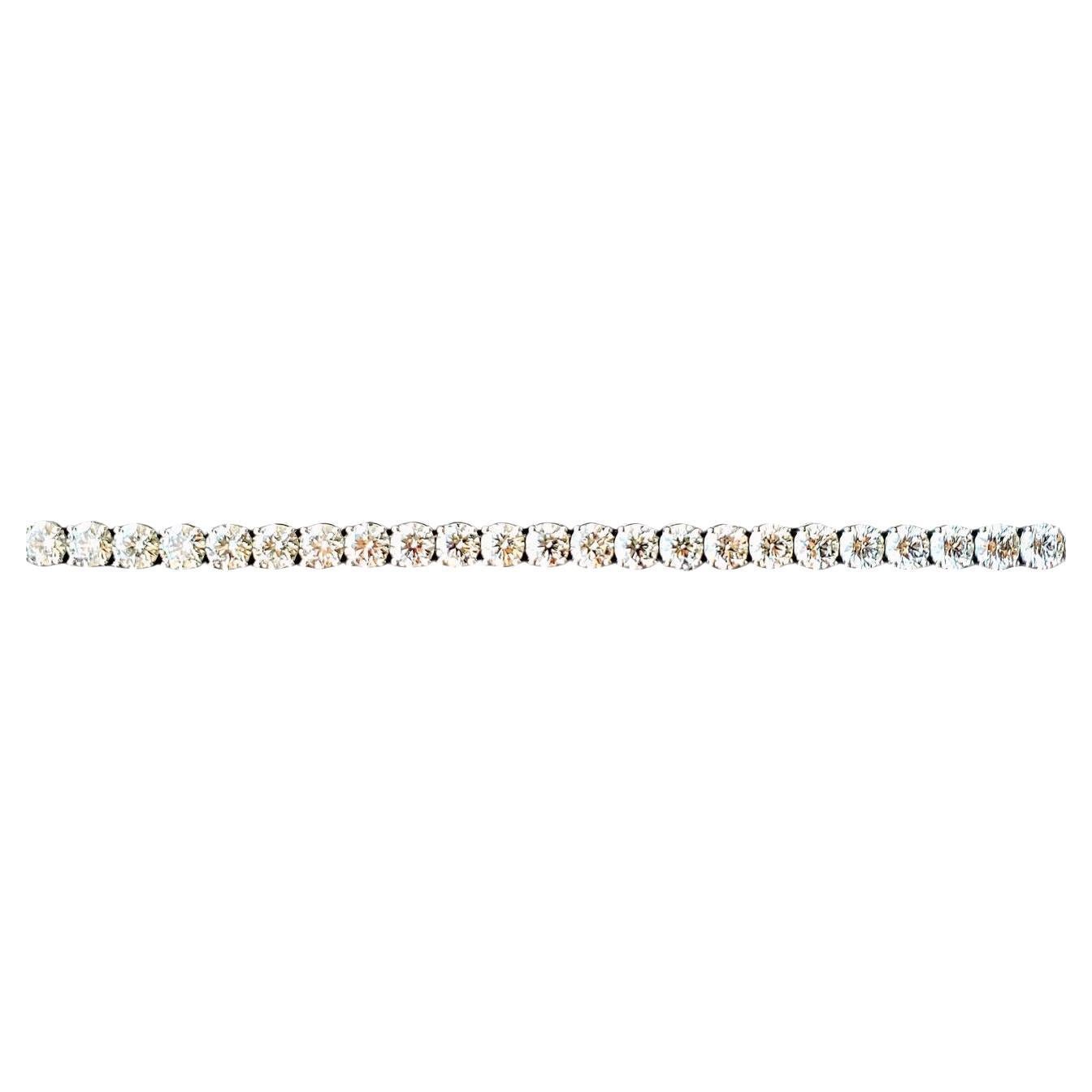 Introducing our exquisite Tennis Bracelet, a true symbol of luxury and elegance. Crafted in luxurious 18kt white gold, this stunning piece features 29 GIA-certified diamonds totaling 24 carats. Each diamond, ranging from 0.80 to 0.85 carats and