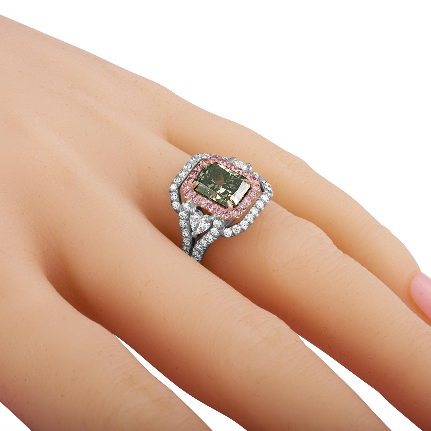 Hand made Platinum Ring for a Radiant Diamond. Radiant in color and in shape. the Deep Green Diamond is set in the center of the ring. Surrounded by a row of Pink Diamonds, 22 Round Brilliants 0.27 Carat Total Weight. The Pink row is surrounded by a