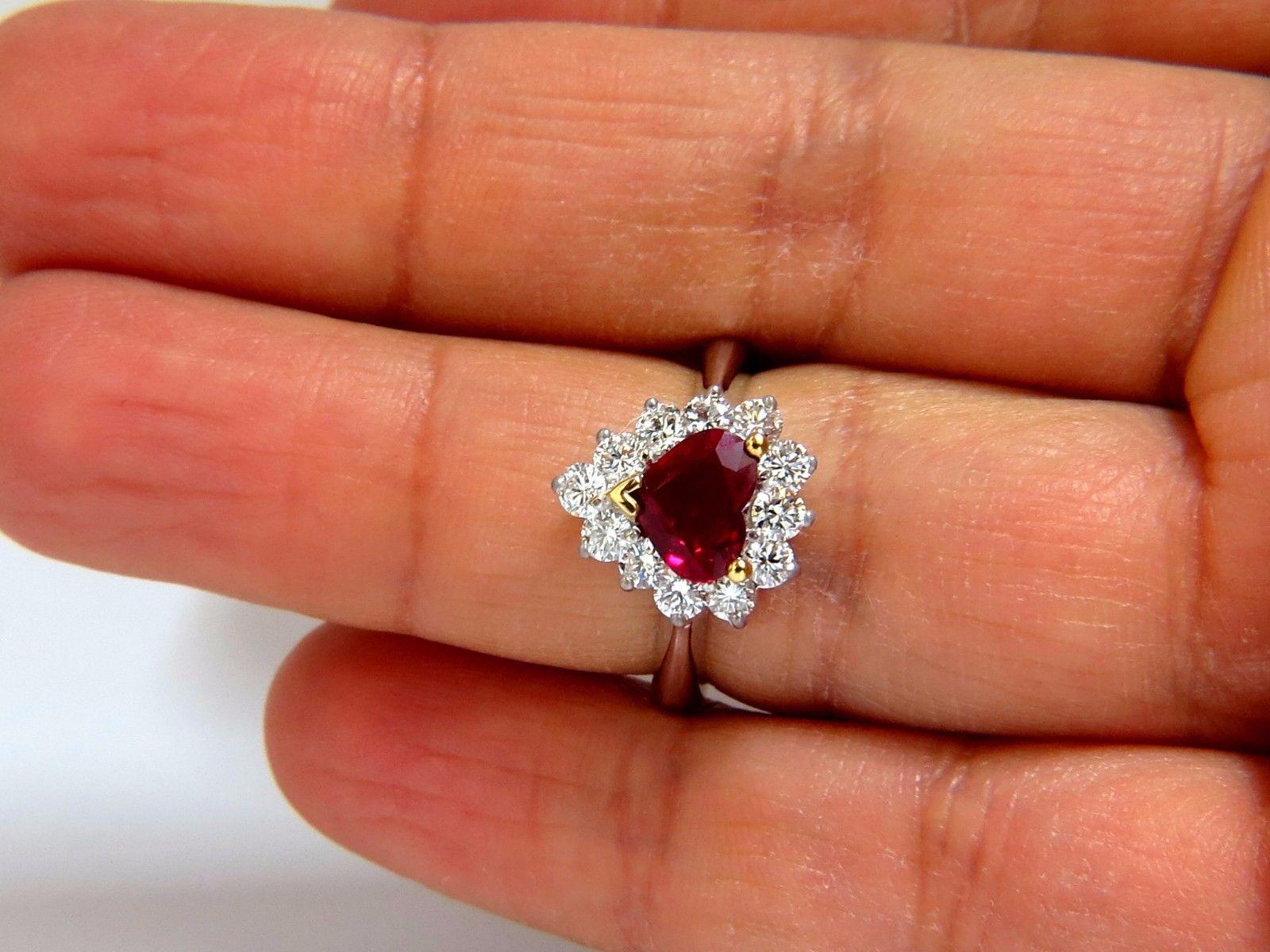 Ruby Love.

GIA Certified 1.36Ct Natural Ruby Ring

Report:  5172094720

Heart cut

Transparent, Red.

6.43 X 8.04 X 3.12mm

Minor Heating.



1.04ct. side round cut diamonds

G-color vs-2 clarity.

14kt white gold.

7 Grams.

Rings Size: