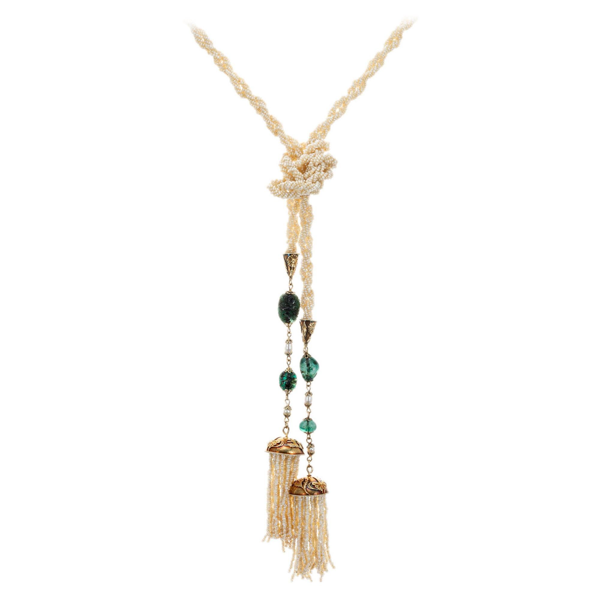 Original 1910 Art Nouveau multi-strand natural seed pearl emerald necklace. GIA Certified natural seed pearls of white color with a slight cream overtone, with four carved and freeform emeralds. 50 inches in length. 

2 carved dark green emerald