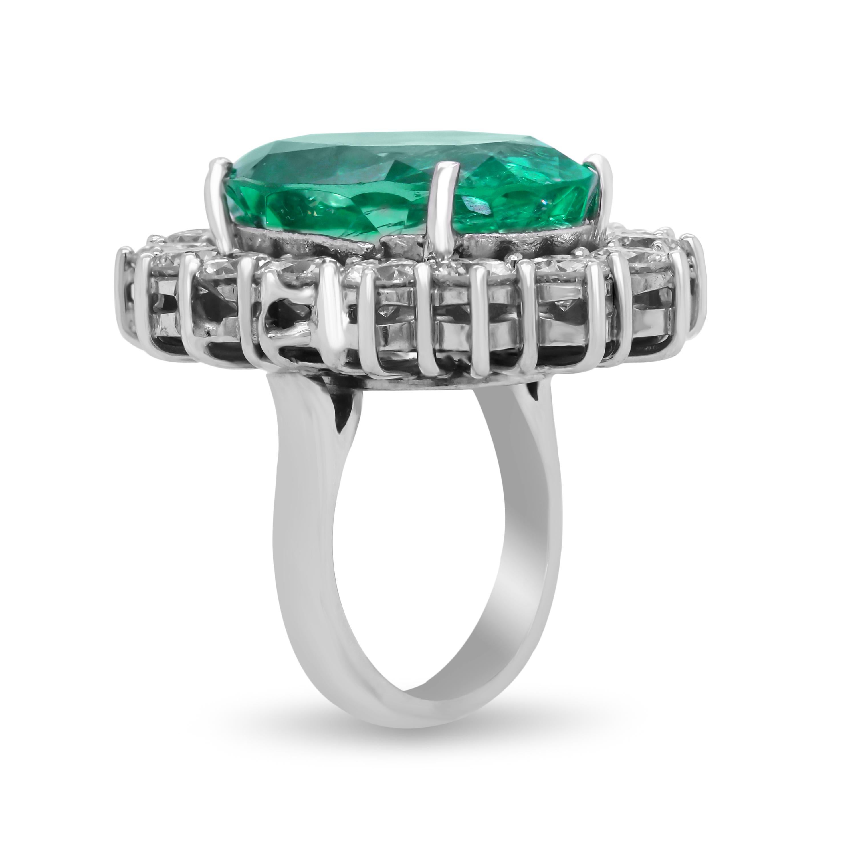 Contemporary GIA Certified 24.13 Carat Oval Colombian Emerald and Diamond White Gold Ring