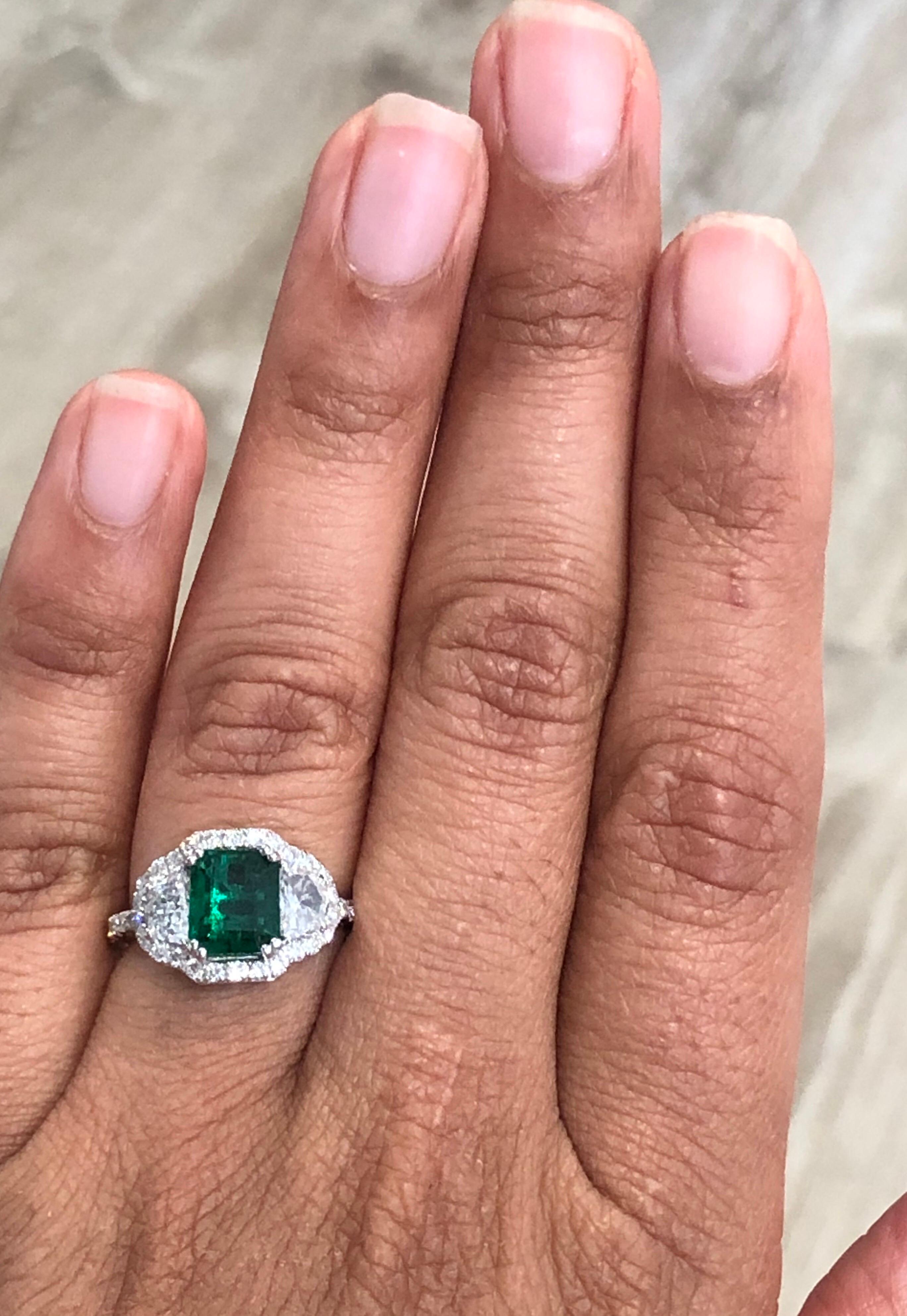 Women's GIA Certified 2.42 Carat Emerald Diamond 18 Karat White Gold Three Stone Ring For Sale