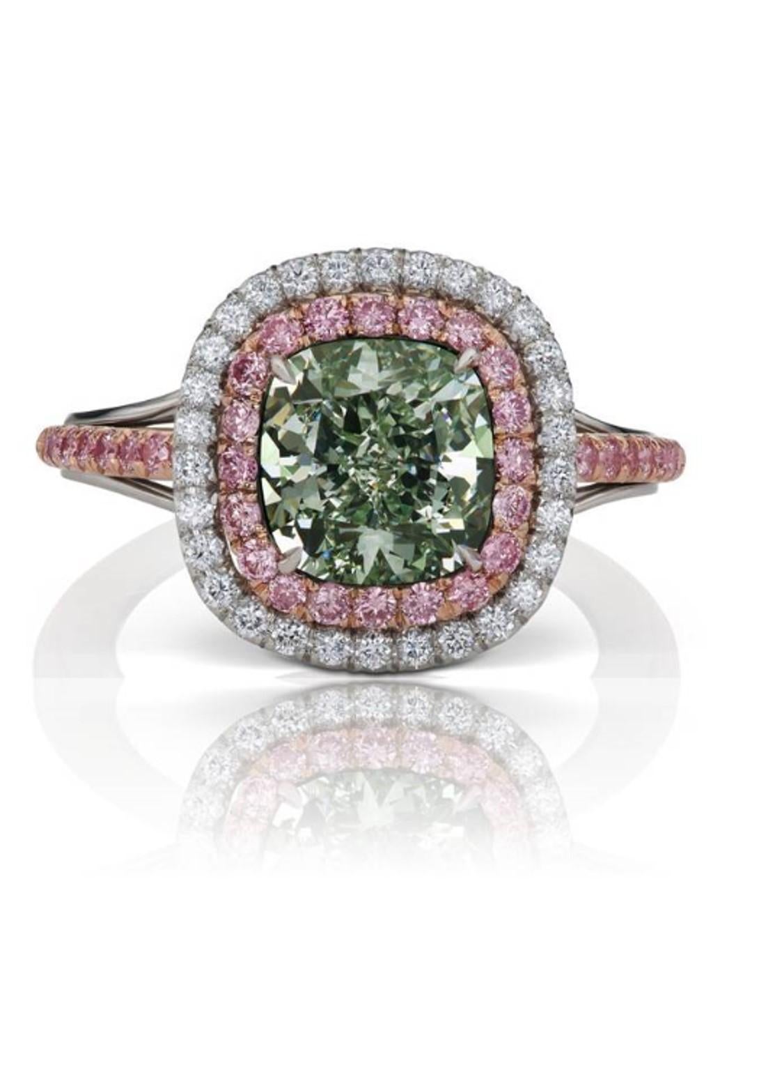 Incredible Deal on GIA Certified 2.44 Carat Cushion Cut, Natural Fancy Green Even I1, Diamond Ring, measuring 7.66-7.26x5.05. Total Carat Weight on the ring is 2.94.
GIA CERTIFICATE #2228474095.  
This incredible setting was custom made to fit this