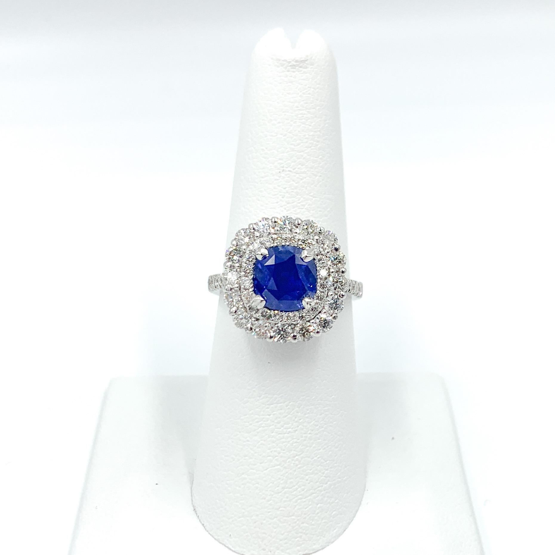 This sapphire is absolutely stunning. It is the famous cornflower blue that the finest quality Kashmir sapphires are known for. The two rows of diamonds highlight just how important this sapphire is. This ring is a head turner! This sale includes