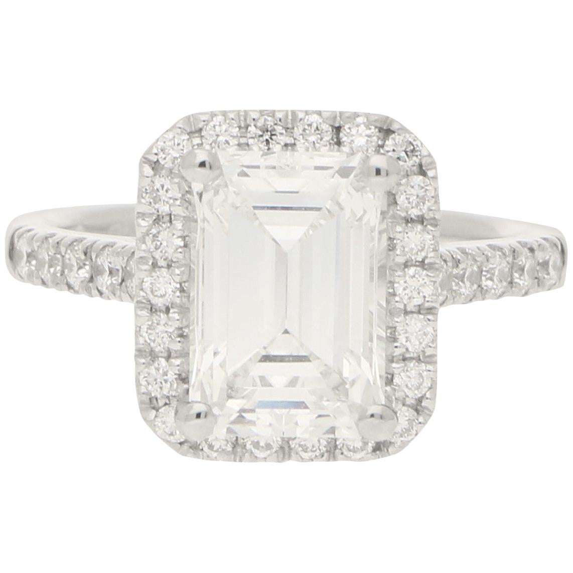 GIA Certified 2.45 Carat Emerald Cut Halo Cluster Engagement Ring in Platinum For Sale