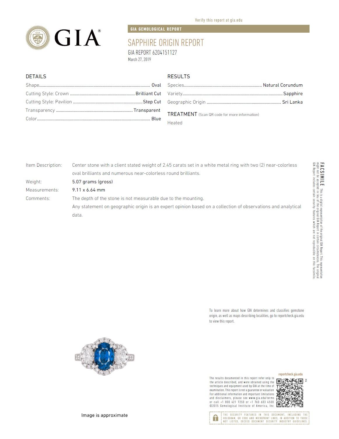 With a GIA Certified 2.45 carat oval cut blue Ceylon sapphire center, set between two elaborate oval cut diamonds and an additional halo of round white diamonds (total diamond weight 1.22 carats), this ring shines from every angle.

GIA