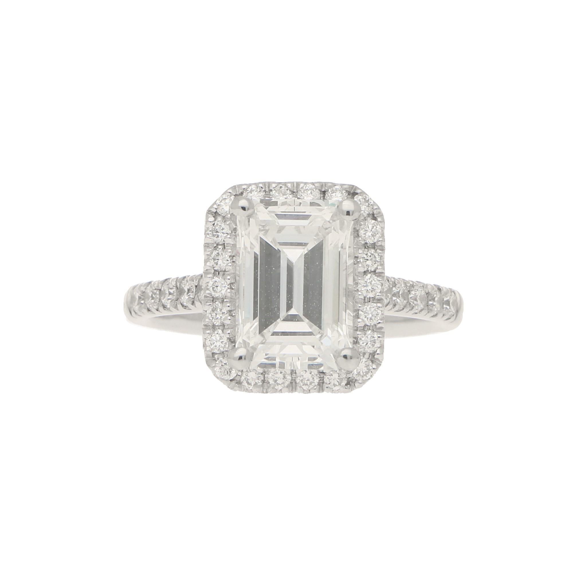 Modern GIA Certified 2.45 Carat Emerald Cut Halo Cluster Engagement Ring in Platinum For Sale