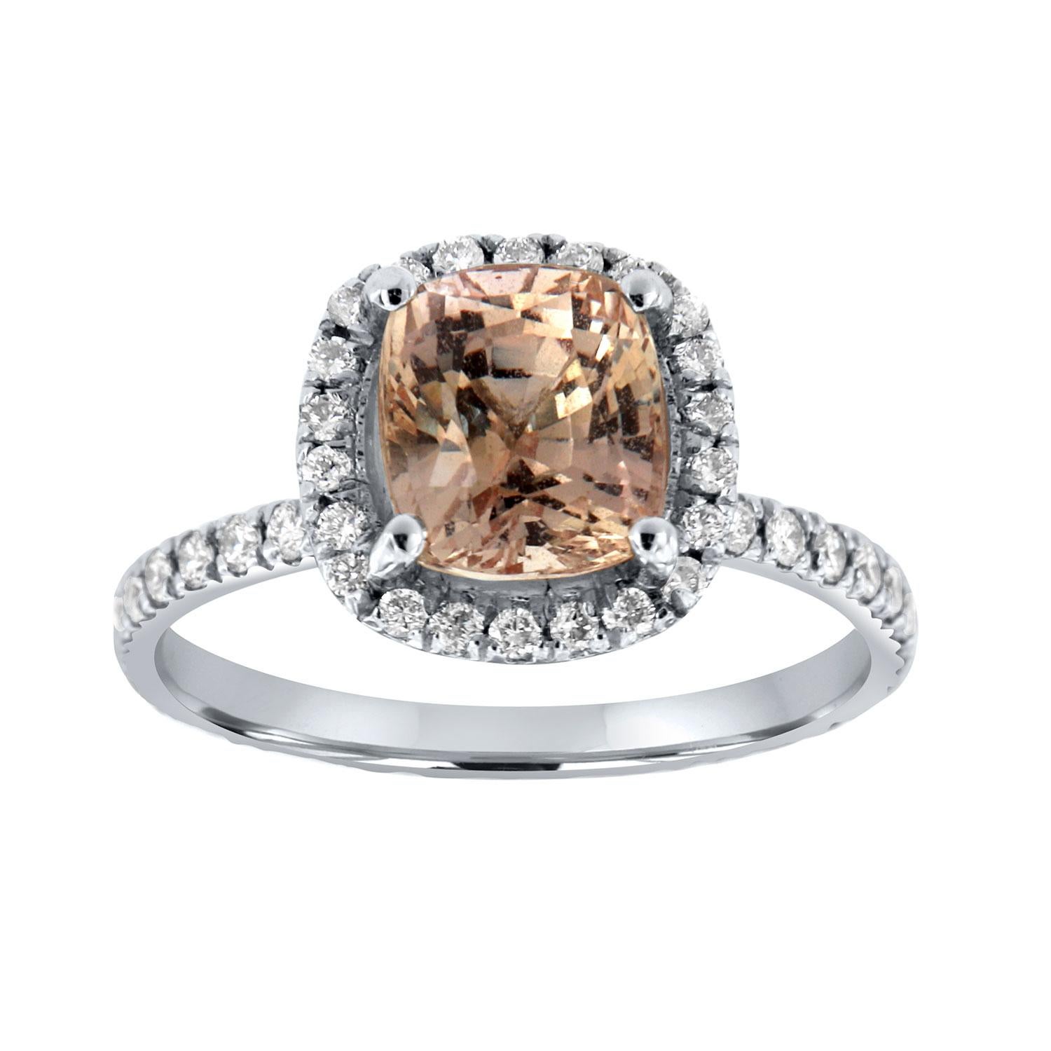 This Platinum Ring Set features a 2.46-carat Cushion shape Pinkish Orange Padparadscha Sapphire encircled by a halo of brilliant round diamonds on top of a 1.6mm wide eternity band. A perfectly matching diamond eternity band completes this delicate