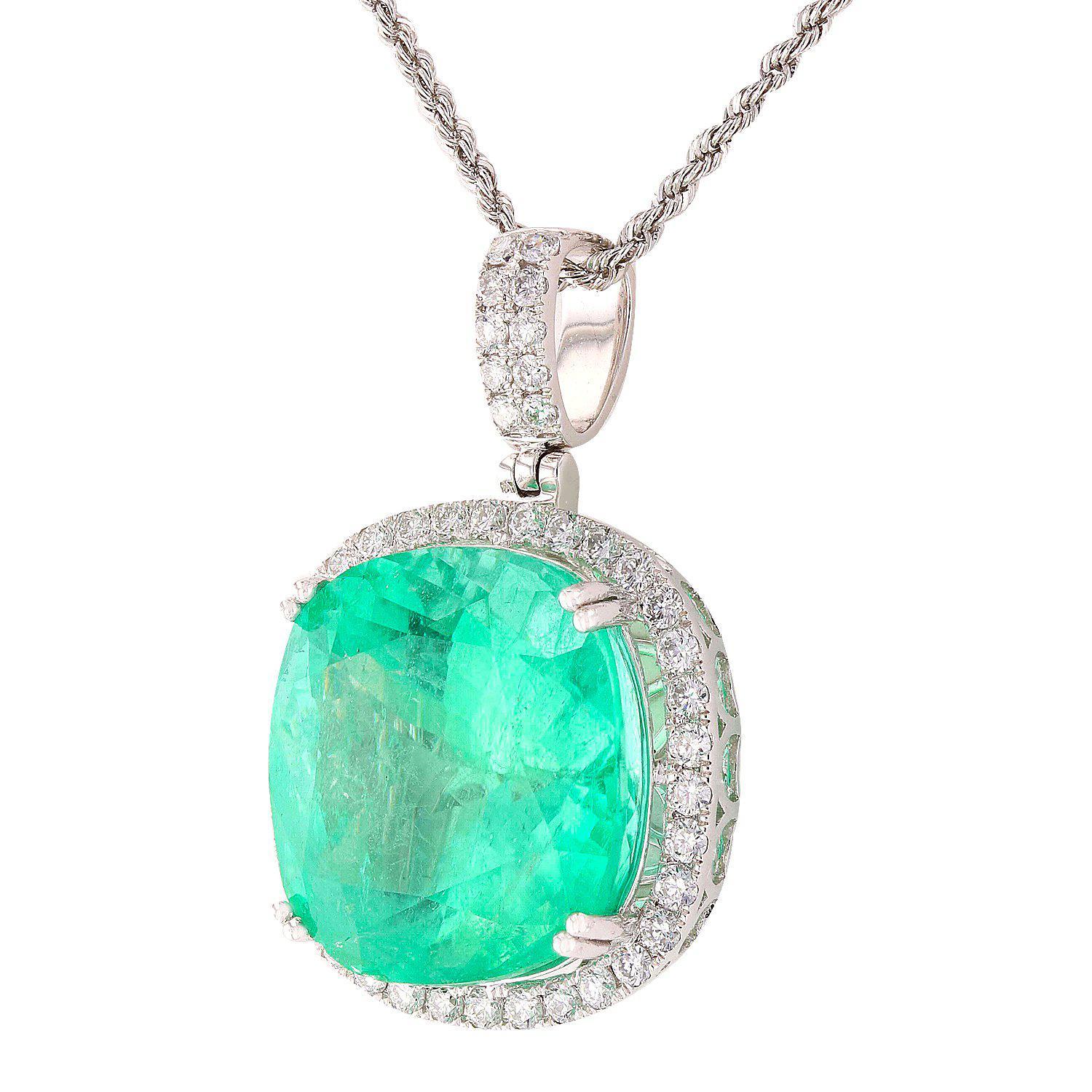 One electronically tested platinum ladies cast & assembled emerald and diamond pendant with chain. The pendant features an emerald set within a diamond bezel and elaborate lattice under gallery, completed by a diamond set bail. The pendant is
