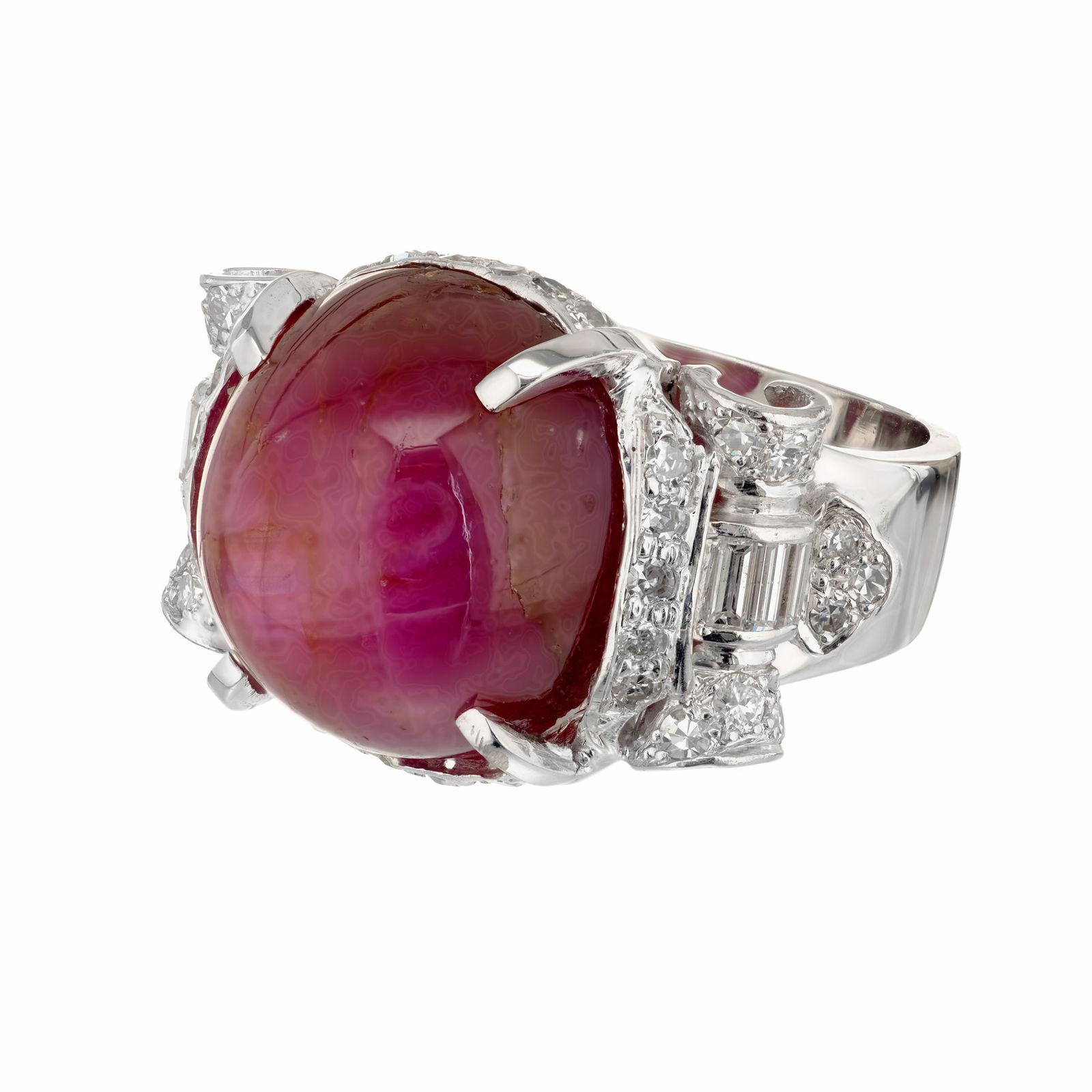 Art Deco Cabochon Star Ruby and diamond cocktail ring. GIA certified natural star Ruby accented with round and baguette diamonds in a 14k white setting. Good Asterism. The bow design diamond top is platinum and the shank is 14k white gold. Moderate