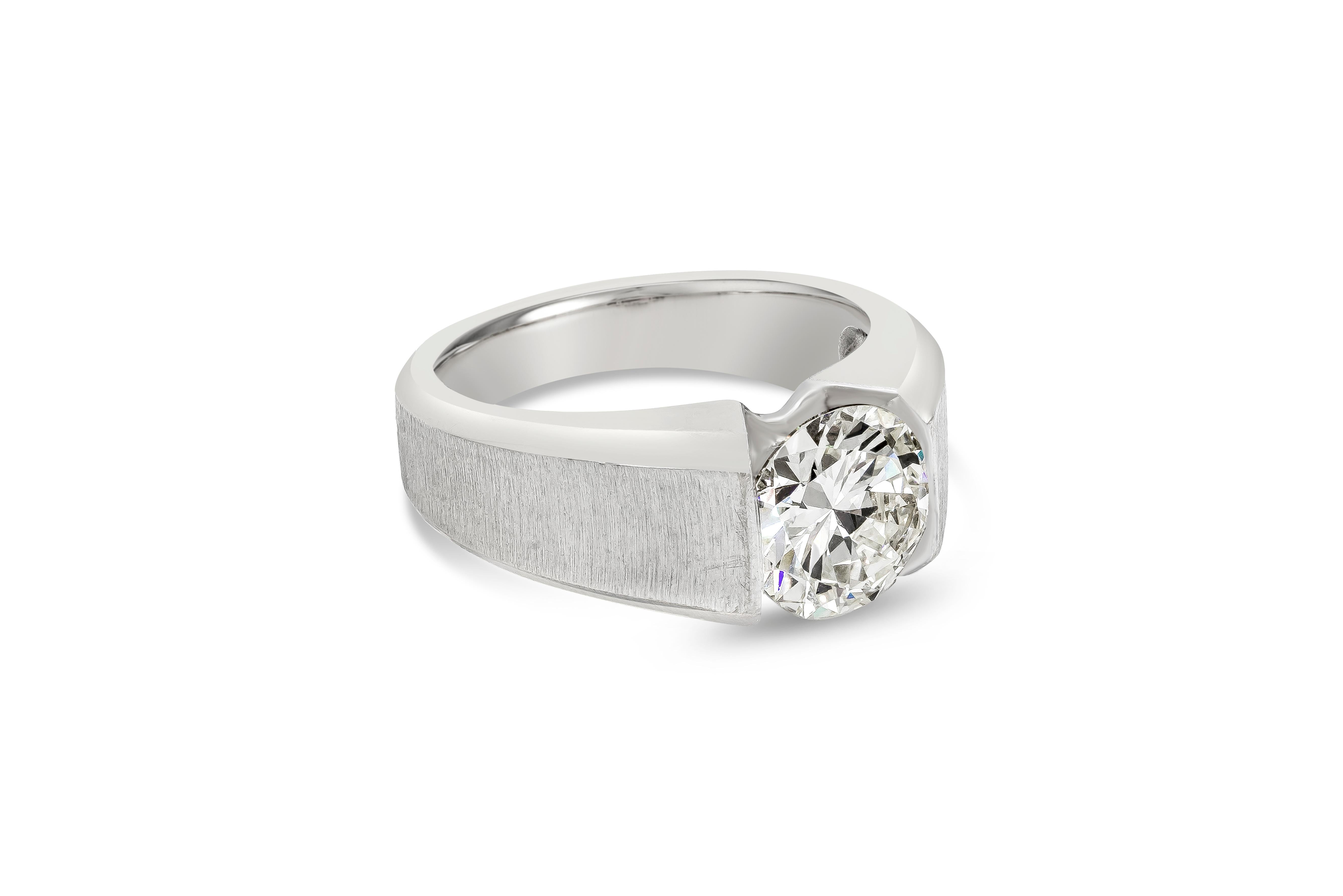 A beautiful men's ring showcasing a 2.49 carat round brilliant diamond certified by GIA as M color, VS1 clarity. Set in a semi-bezel angular setting with a matte finish. Made in platinum. Size 9

Style available in different price ranges. Prices are