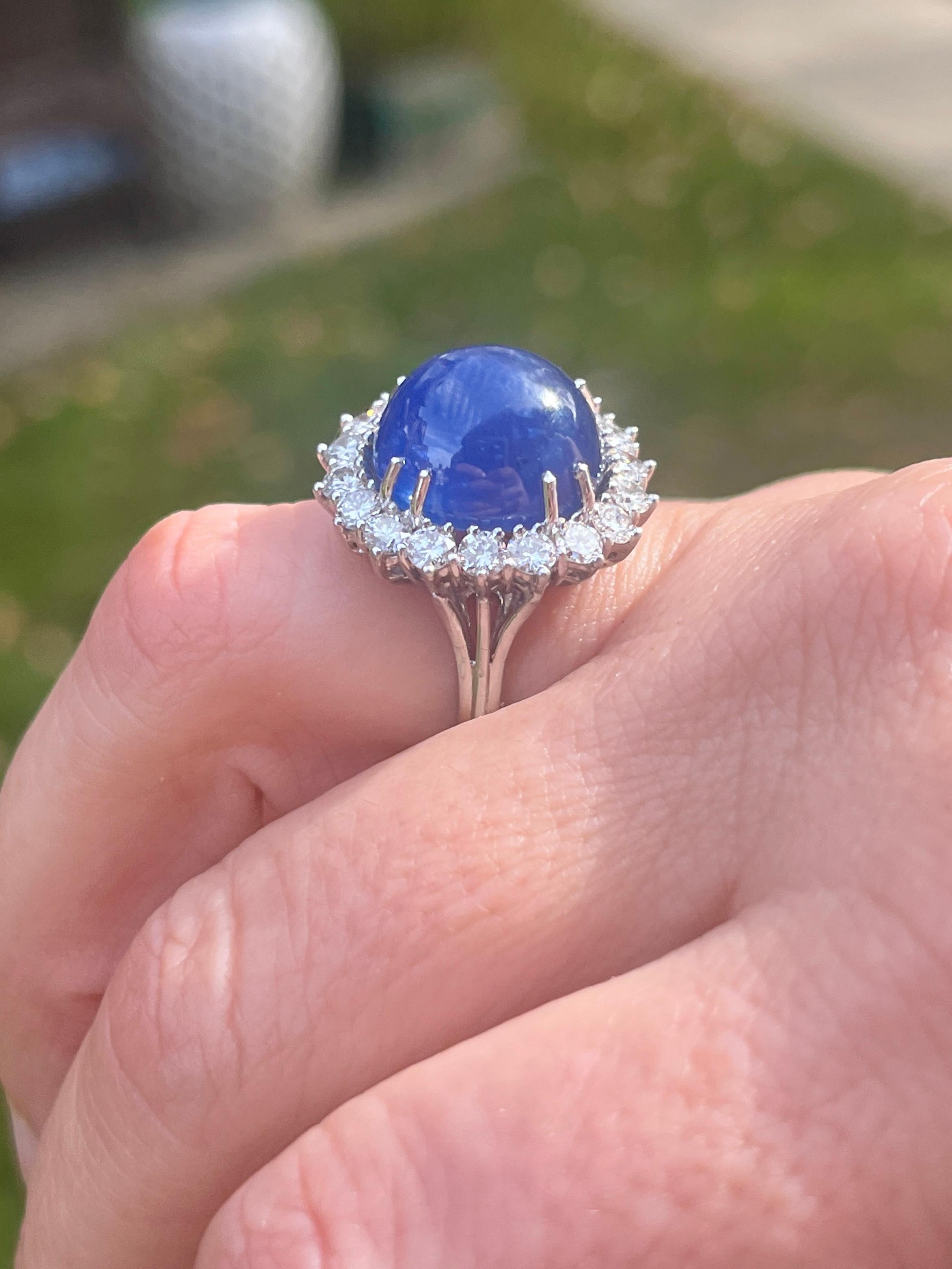 Cabochon GIA Certified 25 Carat Blue Sapphire & Round Diamond Halo Ring in Platinum For Sale