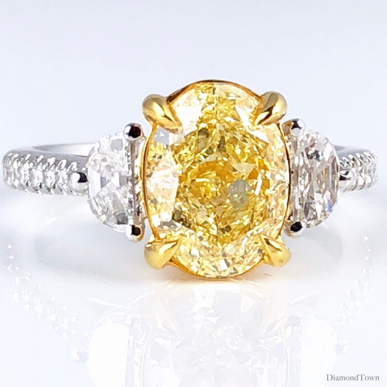 GIA Certified 2.50 Carat Oval Cut Natural Fancy Light Yellow Diamond