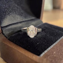 GIA Certified 2.50 Carats E/VVS2 Oval Diamond Half Bezel Ring in 18K White Gold