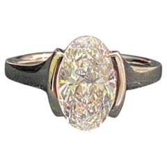 GIA Certified 2.50 Carats E/VVS2 Oval Diamond Half Bezel Ring in 18K White Gold