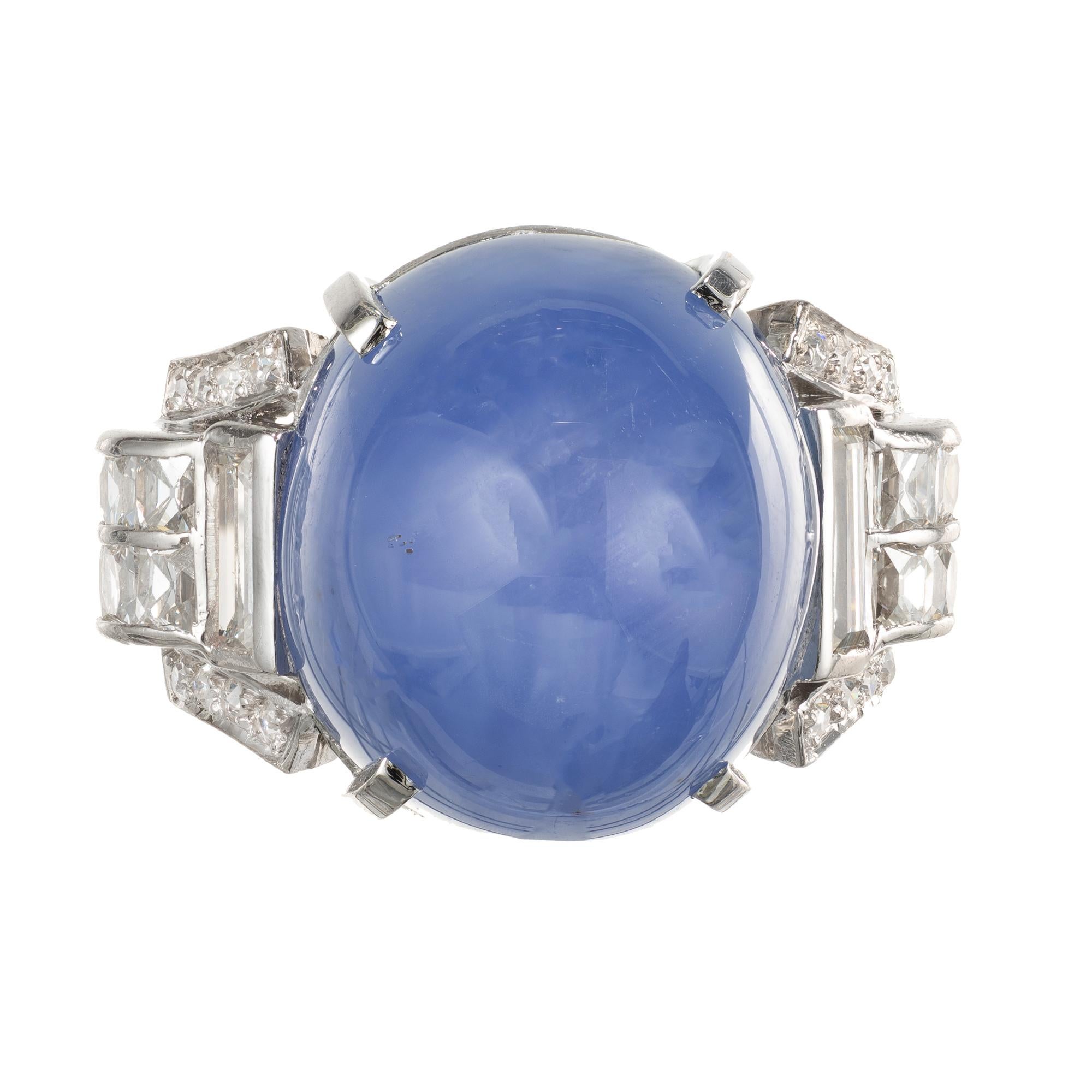 Art Deco 1920's Star sapphire and diamond ring. Handmade Platinum setting with a sugar loaf cut cabochon-medium blue center Star Sapphire with accent diamonds. GIA certified natural with no enhancements.

1 oval cabochon blue Star Sapphire, approx.