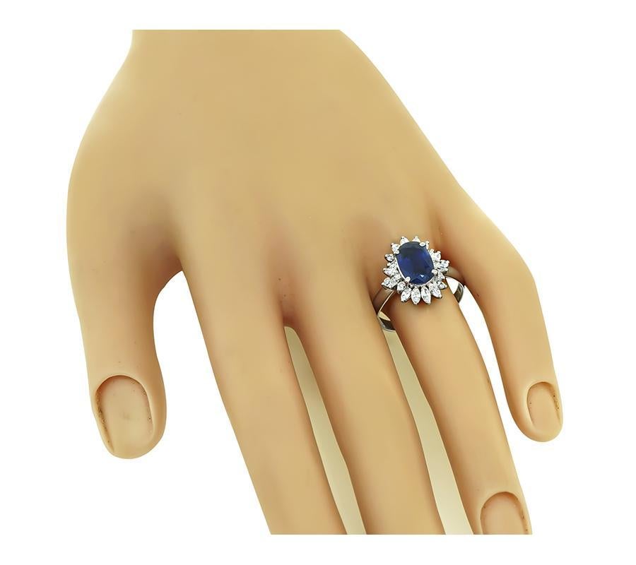 This is an elegant platinum engagement ring. The ring is centered with a lovely GIA certified oval cut sapphire that weighs approximately 2.51ct. The sapphire is accentuated by sparkling marquise and round cut diamonds that weigh approximately