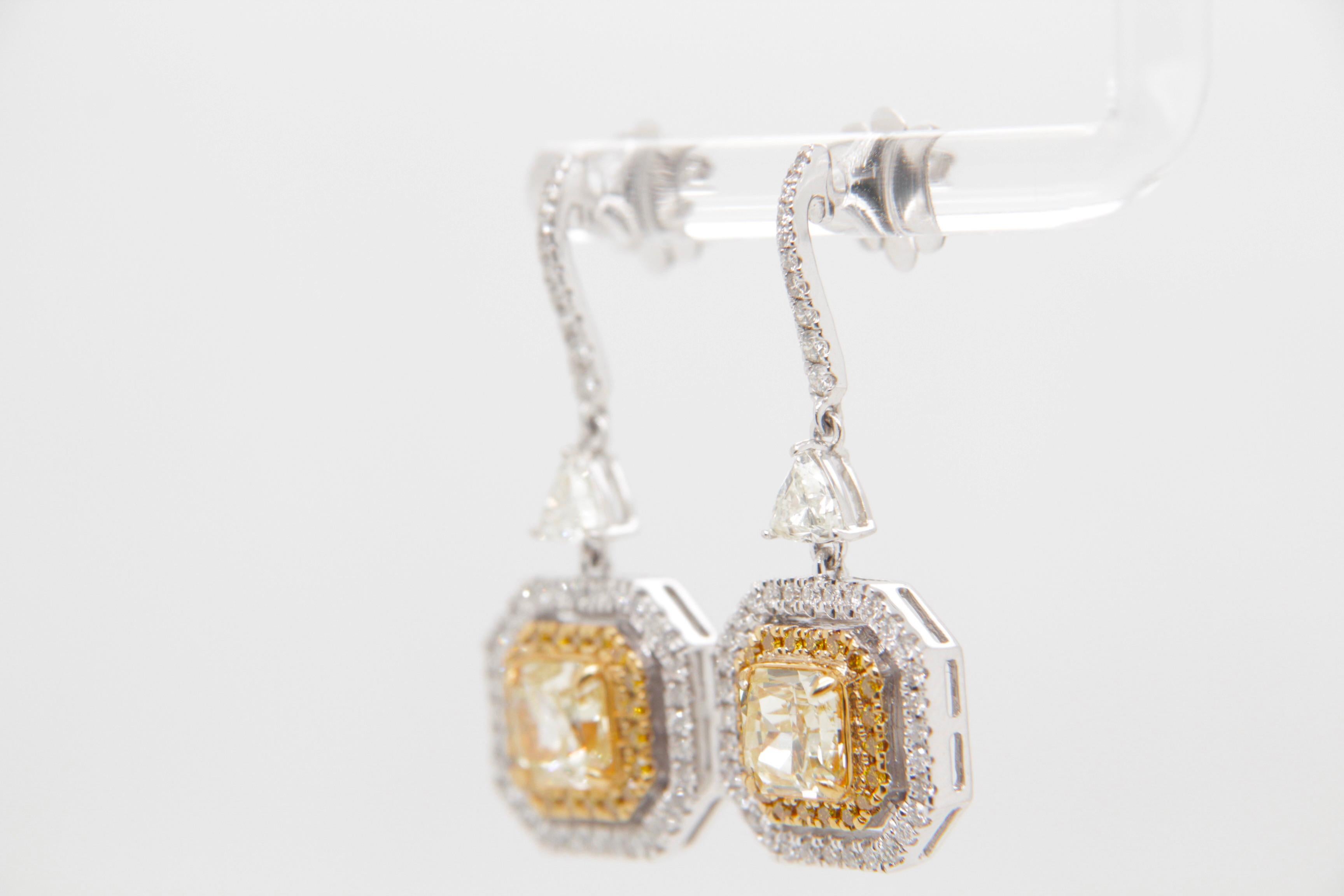 Radiant Cut GIA Certified 2.53 carat Fancy Light Yellow Dangle Earrings For Sale
