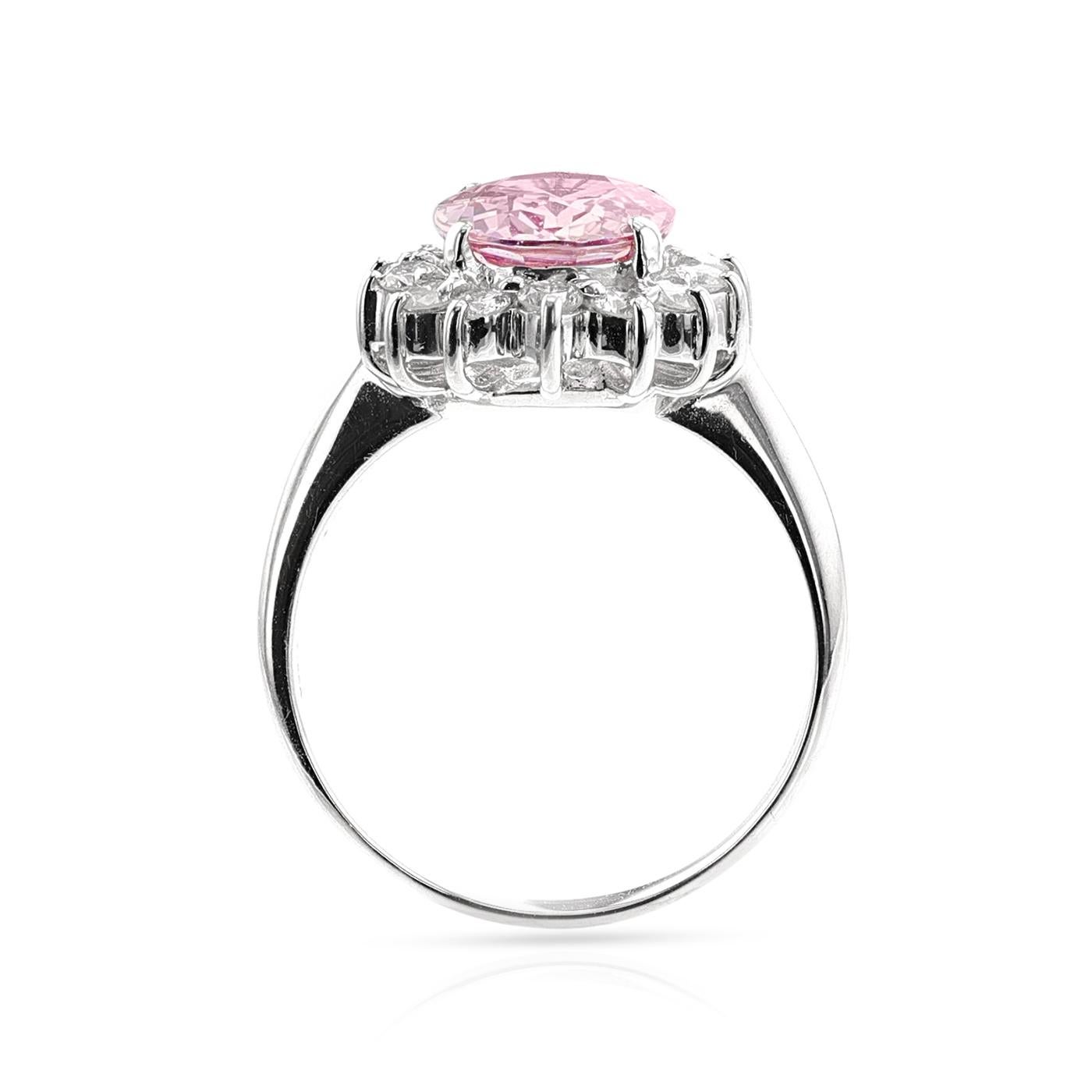 A beautiful and pleasant natural pink sapphire and diamond platinum ring, set with an oval-shaped mixed-cut unheated pink sapphire weighing 2.53-carats and surrounded by a cluster of round brilliant-cut diamonds weighing approximately 0.45-carats;