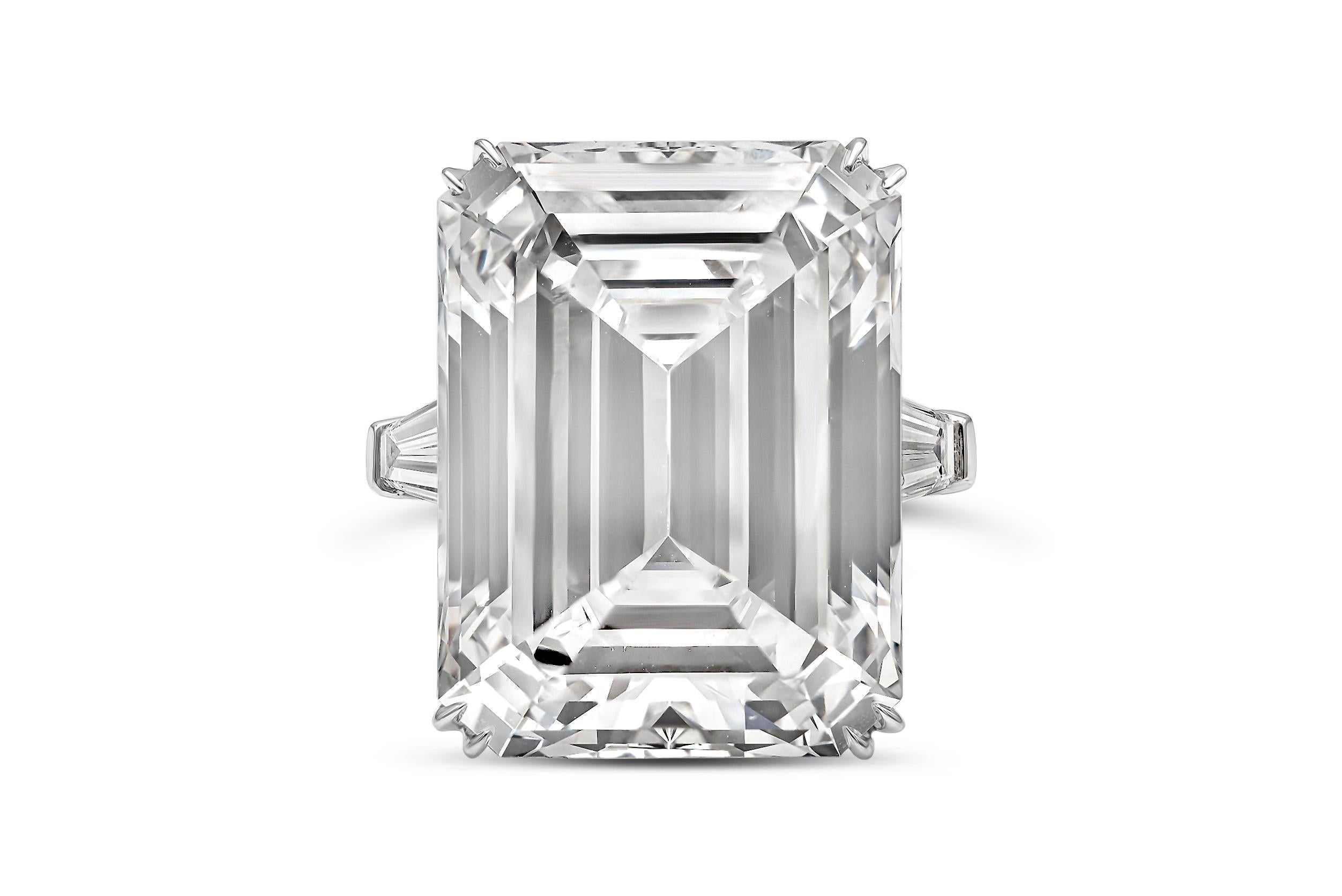 An important and very rare engagement ring, showcasing a 25.32 carats emerald cut diamond certified by GIA as D color and IF clarity, with excellent polish and excellent symmetry. The center stone is flanked by tapered baguette diamonds weighing