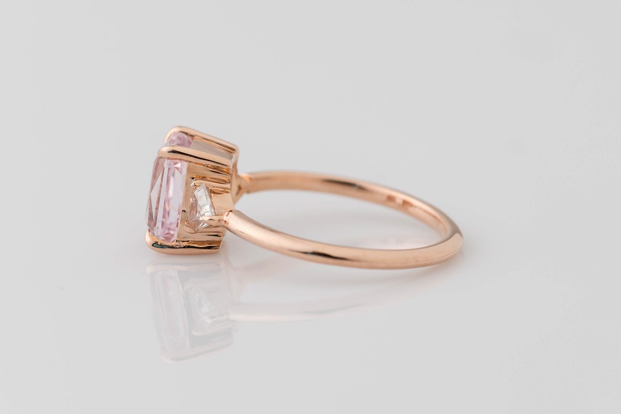 Introducing our exquisite 14K Rose Gold 3-Stone GIA Radiant Cut Peach Sapphire Ring, a mesmerizing blend of elegance and charm! Featuring a stunning GIA-certified 2.54 Ct center stone, measuring 7.91x5.89x4.97MM, this natural and unheated beauty is