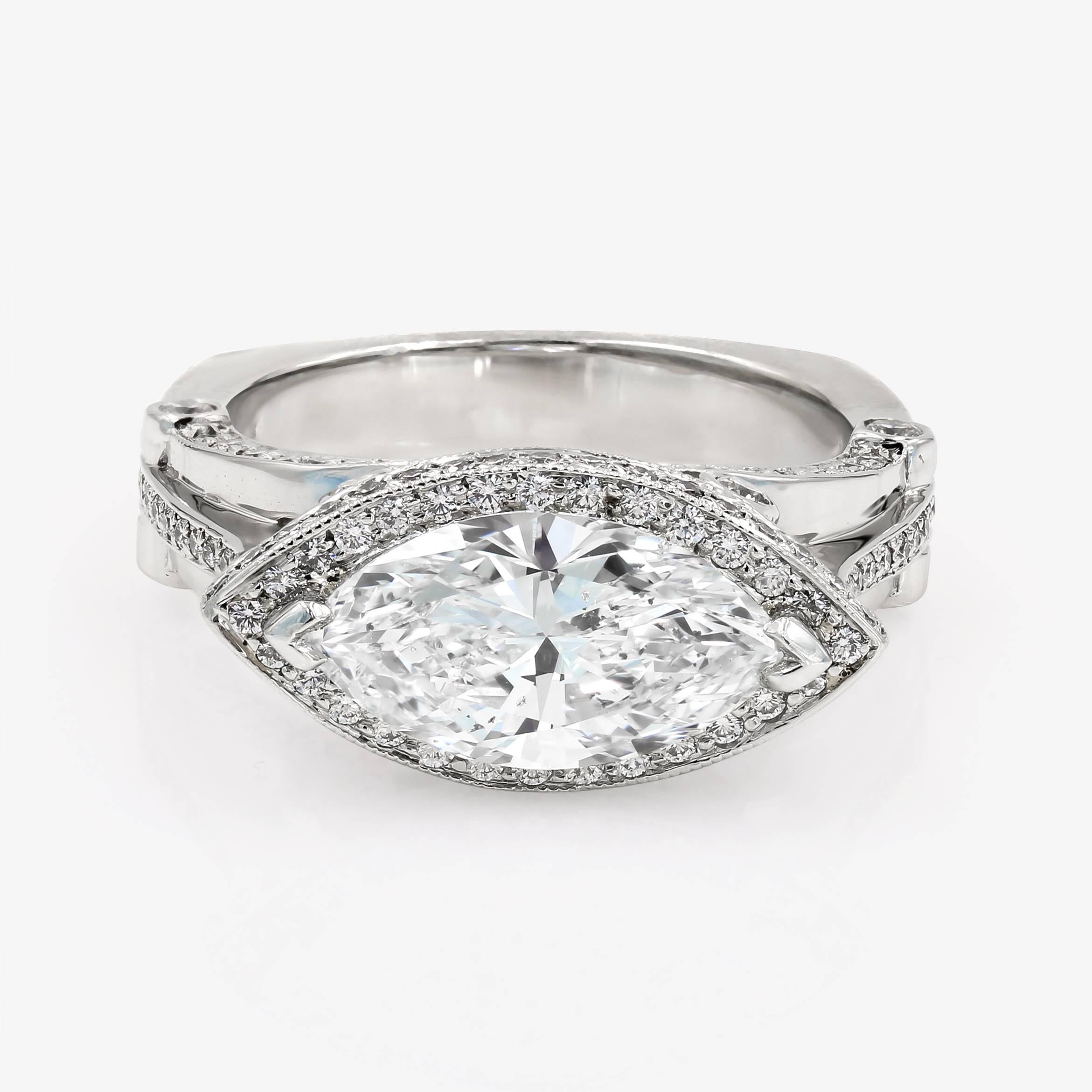 This stunning platinum ring contains a 2.54cts. marquise cut center H color and SI2 clarity, with 132 ideal cut round diamonds= .77ct. t.w. set in a halo style around the center and on the sides of the shank. (accent diamonds are G/VS)

This pieces