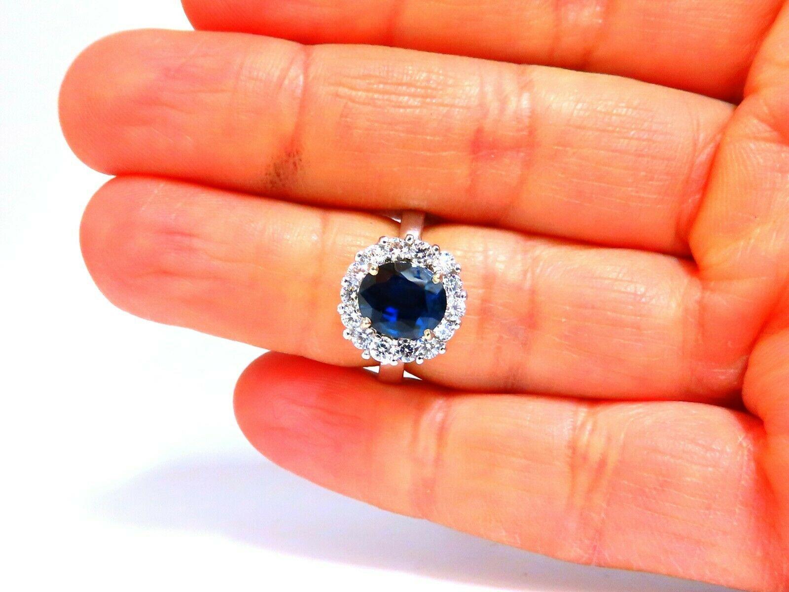 Classic Halo Cluster

GIA Certified 

2.54ct. Natural Teal Blue Sapphire ring.

Report:  1355608477

Oval cut: 9.21 x 7.80 x 4.09mm

Clean Clarity, Transparent

Even Blue



1ct. Side natural Round diamonds

G color, Vs-2 clarity.

14kt. white