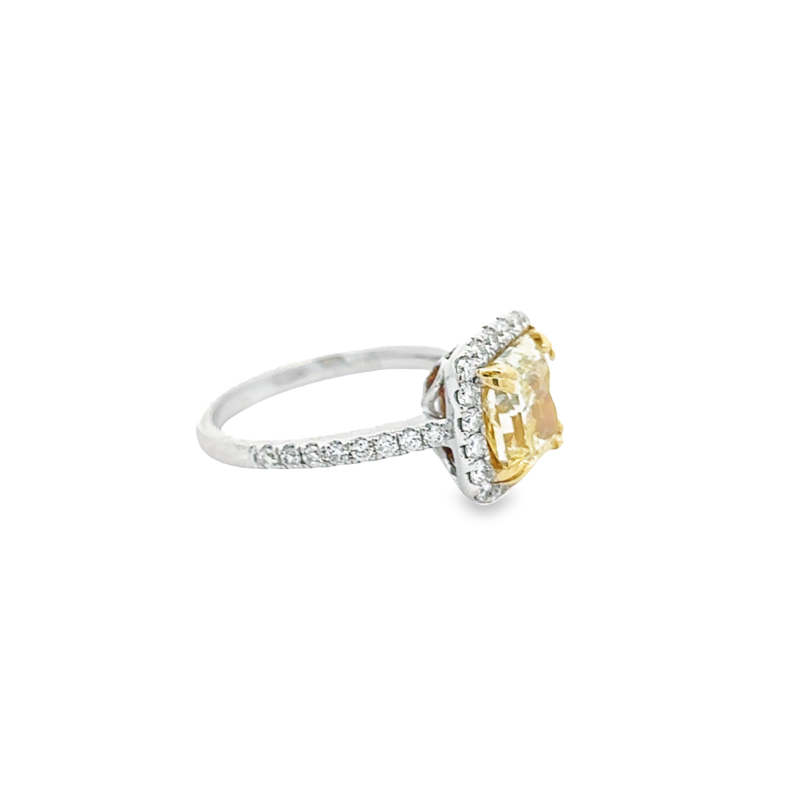 Contemporary GIA Certified 2.55 carat Fancy Light Yellow VS1 Radiant Cut Halo Ring For Sale