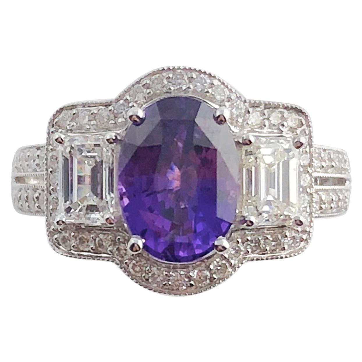 Introducing an exquisite ring featuring a GIA Certified 2.55 carat oval cut Bicolor Sapphire as its captivating centerpiece. This unique sapphire exhibits a mesmerizing change of color, transitioning from violet to purple under varying lighting