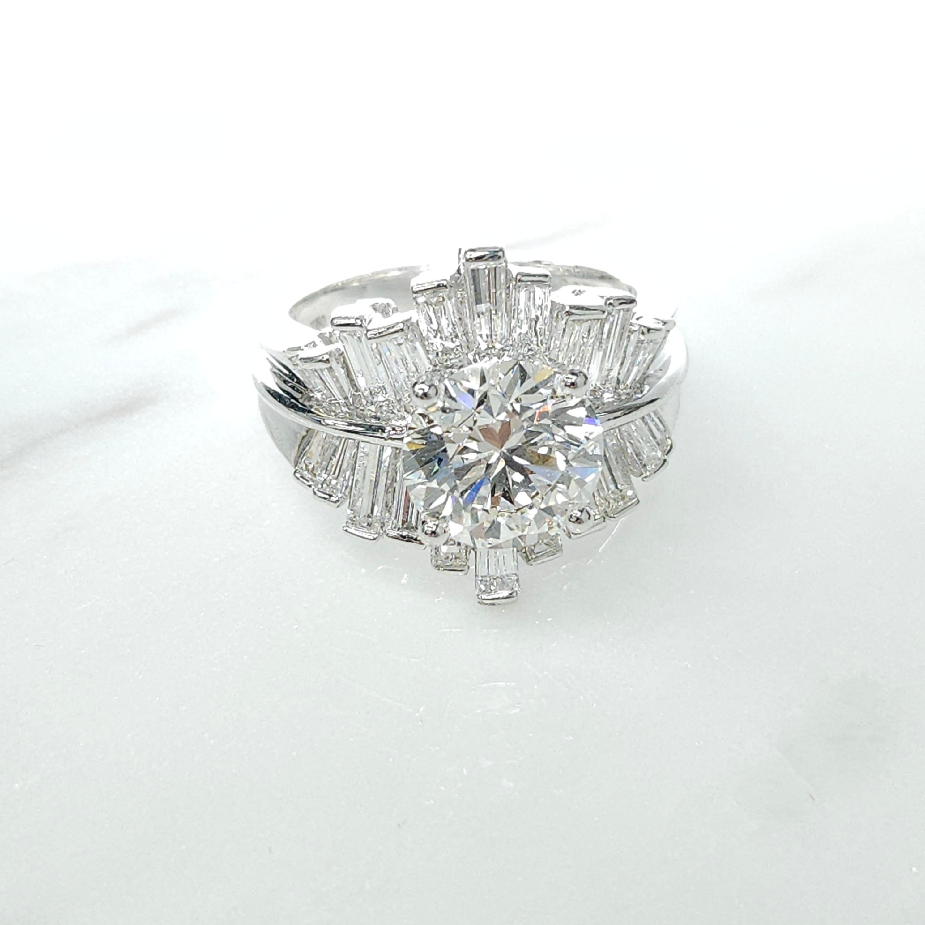 Prepare to be captivated by the eternal beauty and sophistication of this exceptional GIA Certified 2.55 Carat Natural Round Diamond Ring, crafted in a modern and unique style, set in luxurious 18K white gold. The centerpiece of this exquisite ring