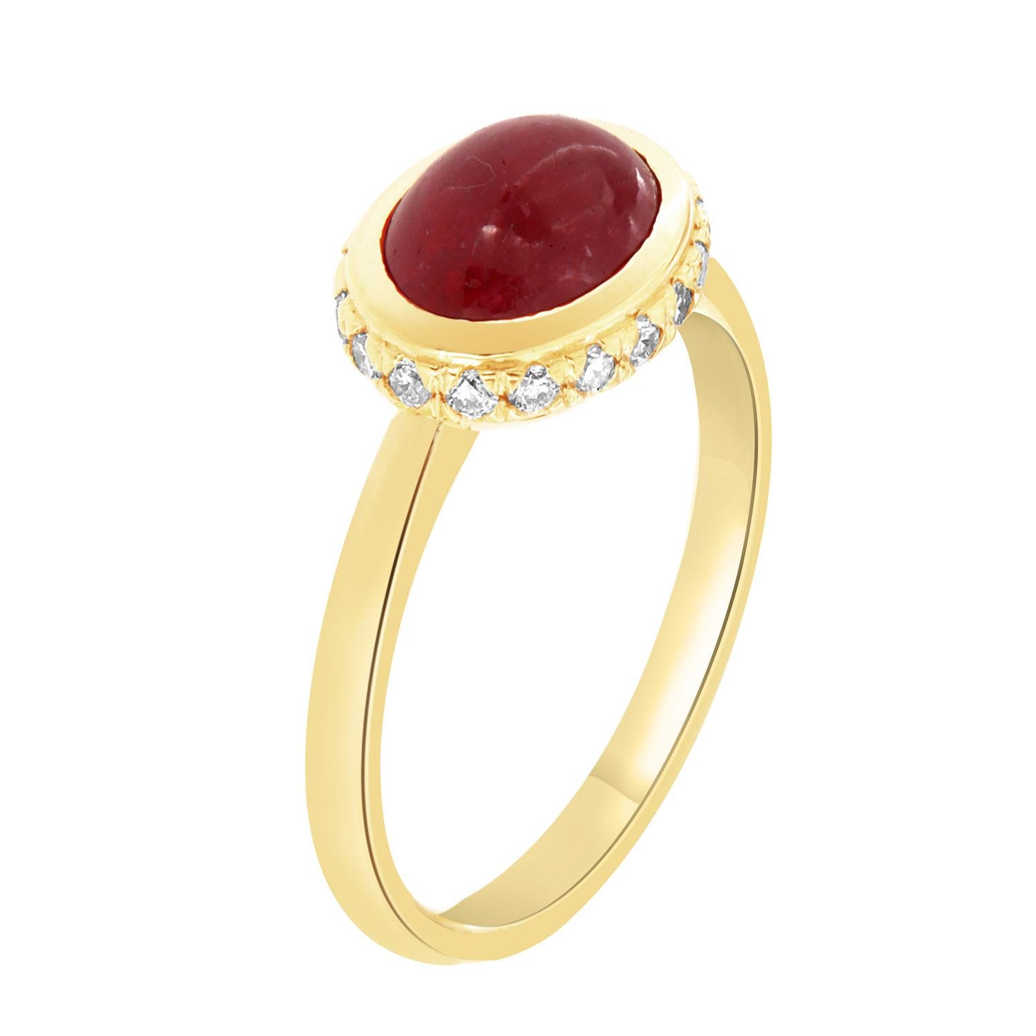 This 18k yellow gold delicate ring features a 2.56 Carat Cabochon Ruby bezel set East-West style. Eighteen (18)Brilliant round diamonds are micro-prong set in a hidden halo on the crown to create the sparkle look every woman is looking to have. The