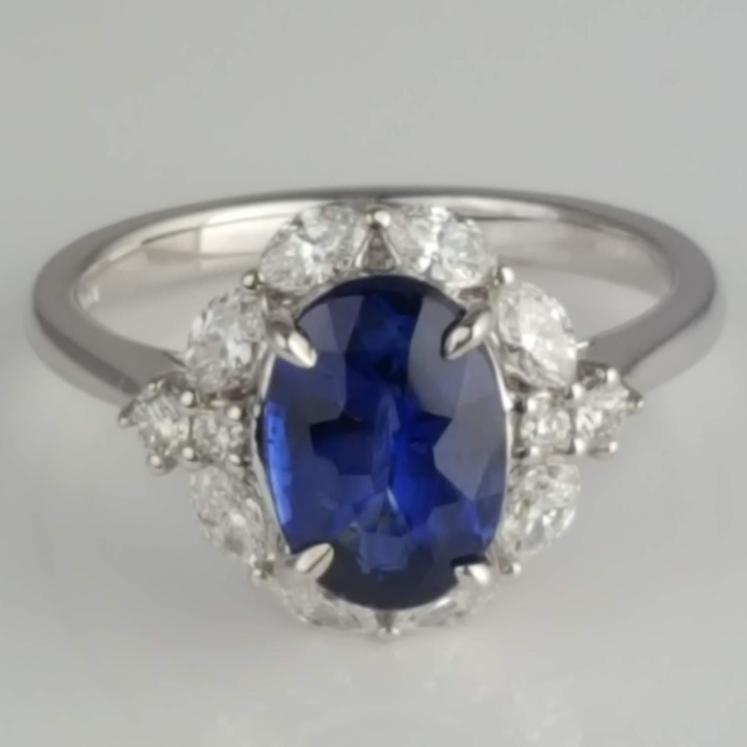 (DiamondTown) This stunning ring not only features a gorgeous GIA Certified oval cut 2.57 carat Ceylon sapphire center, but it is also enhanced by a halo of marquise cut diamonds (total weight 0.67), making it perfect for any occasion. 

GIA
