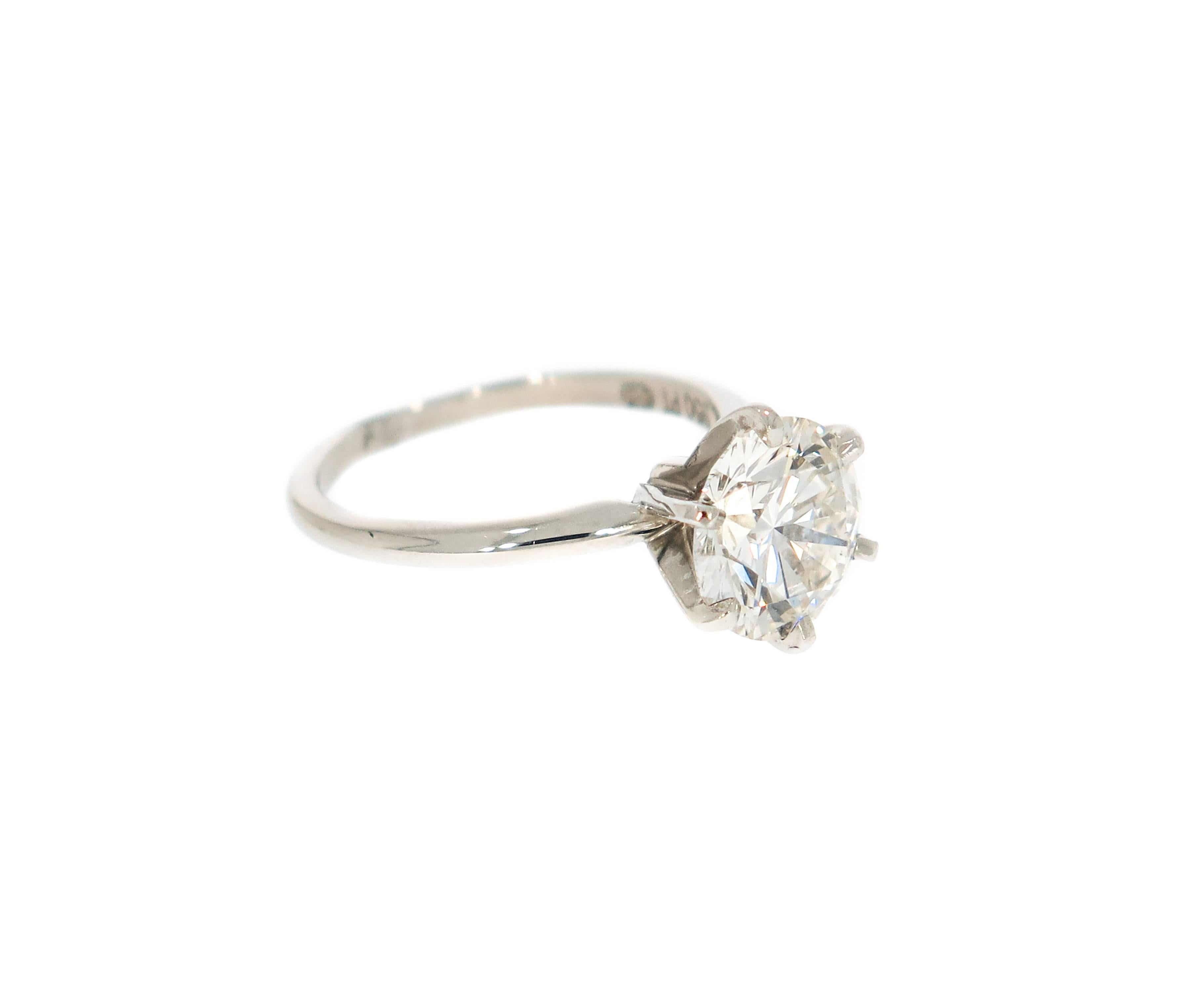 All eyes will be on your center diamond, in this Solitaire Round cut Diamond Engagement Ring. 
A sleek band that brings your brilliant round cut diamond to life, making it worthy of your love. 
Handcrafted in Platinum, this ring features a GIA