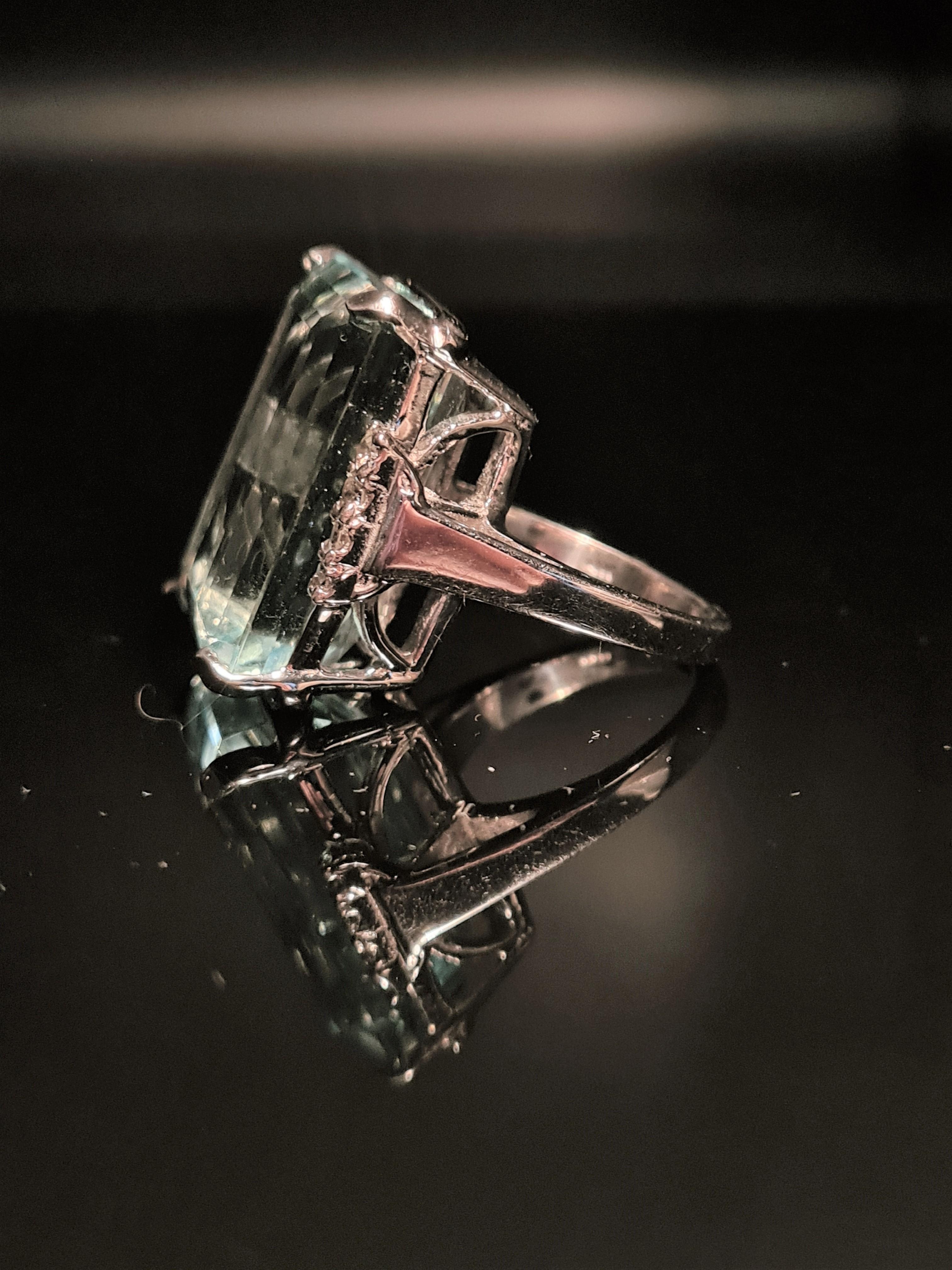 Stunning Aquamarine and Diamond ring set in 14kt white gold mounting. GIA Certificate included with sale. 

Primary stone
Species: Natural Beryl
Variety: Aquamarine
Shape and cut: Octagonal Step cut
Weight: *25.84 cts ±
Measurements: 23.50 x 15.00 x