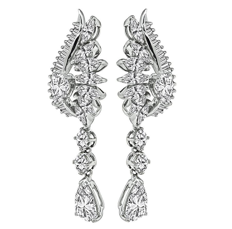 This is a stunning pair of 18k white gold earrings. The earrings feature 2 sparkling GIA certified diamonds that weigh 1.33ct and 1.25ct; the color of the diamonds is H with I1 clarity and G with I1 clarity respectively. The pear shape diamonds are