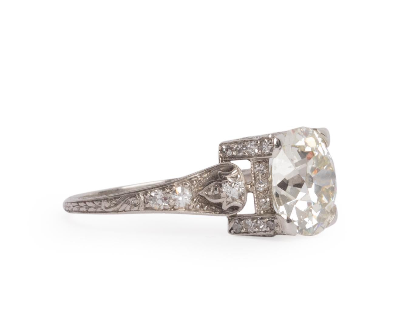 Ring Size: 6.5
Metal Type: Platinum  [Hallmarked, and Tested]
Weight:  3.45 grams

Center Diamond Details:
GIA REPORT #:2215072482
Weight: 2.60 carat
Cut: Antique Cushion - Old Mine Brilliant
Color: M
Clarity: SI2

Side Diamond Details:
Weight: .25