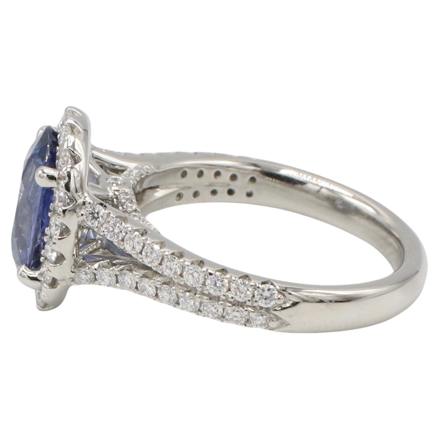 GIA Certified 2.62 Carat Natural Oval Blue Sapphire & Diamond Halo Ring 
Metal: 18k white gold
Weight: 8.37 grams
GIA report number: 2225329528
Sapphire: 2.62 carats oval natural blue sapphire
Diamonds: Approx. 0.60 carats natural round F-G VVS