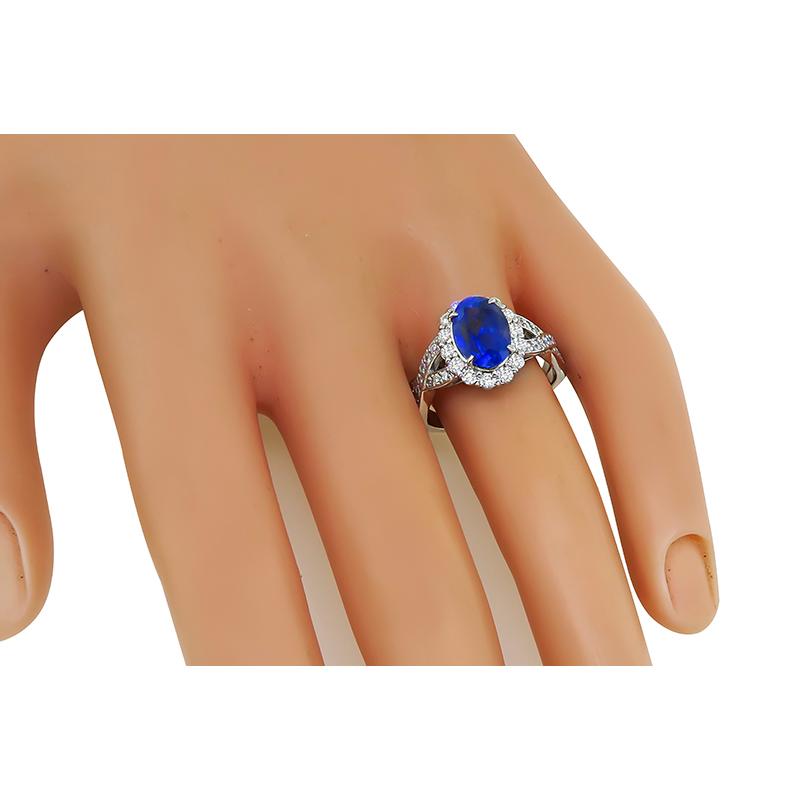 This is a gorgeous platinum engagement ring. The ring is centered with a lovely GIA certified oval cut no heat Sri Lankan sapphire that weighs 2.62ct. The sapphire is accentuated by sparkling round cut diamonds that weigh approximately 0.57ct. The